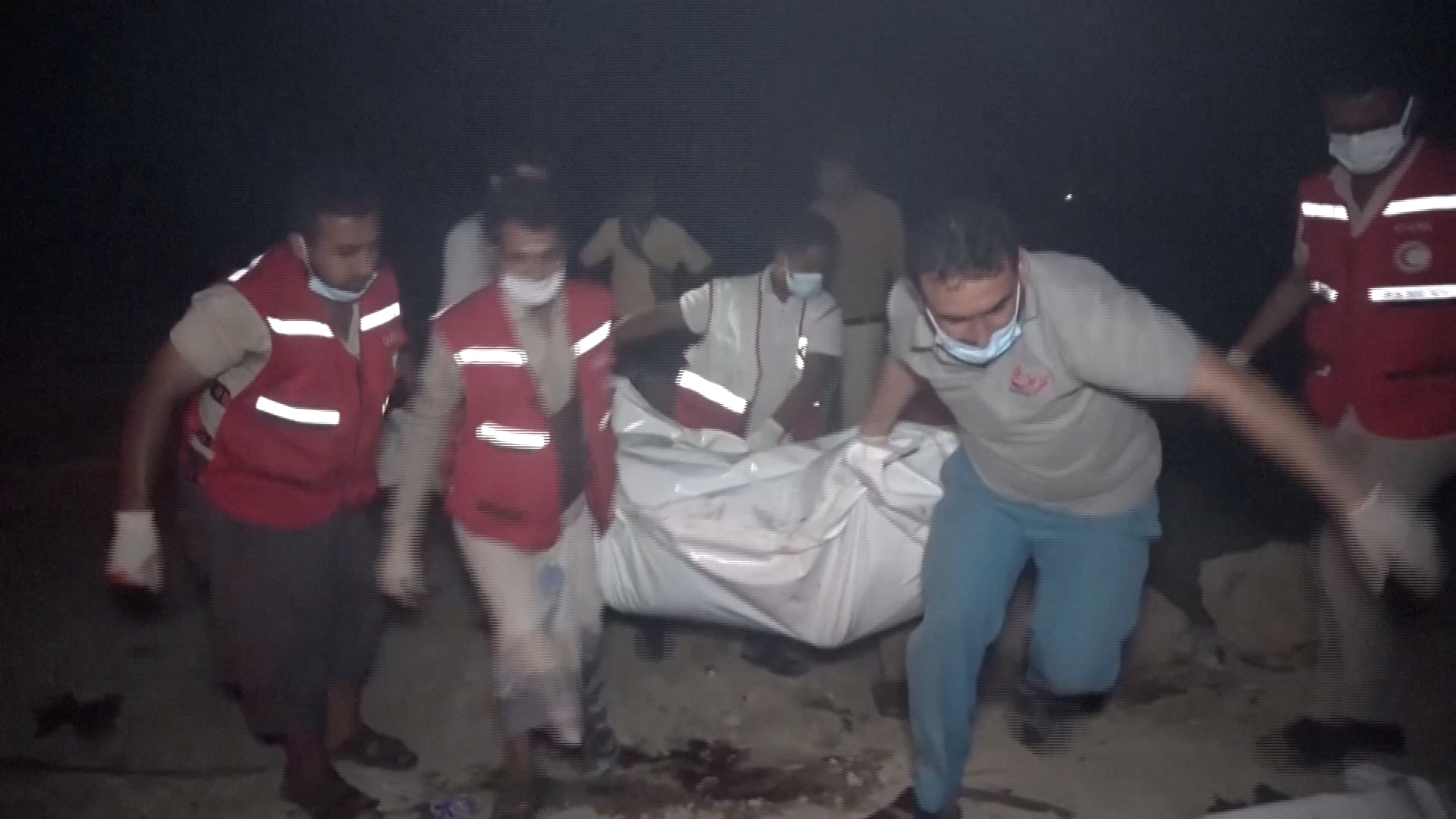Red Crescent personnel move the body of a victim following, what Al Masirah TV said, was a U.S. strike on the Ras Isa fuel port, Yemen, in this screengrab from a handout video released on April 18, 2025. Al-Masirah TV /Handout via REUTERS THIS IMAGE HAS BEEN SUPPLIED BY A THIRD PARTY. NO RESALES. NO ARCHIVES