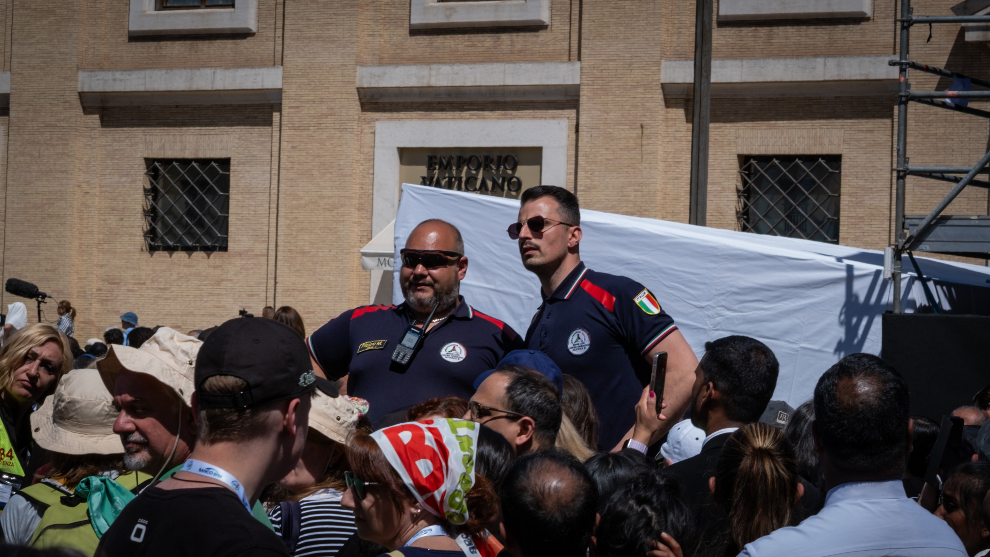 Civil volunteers help manage the crowds