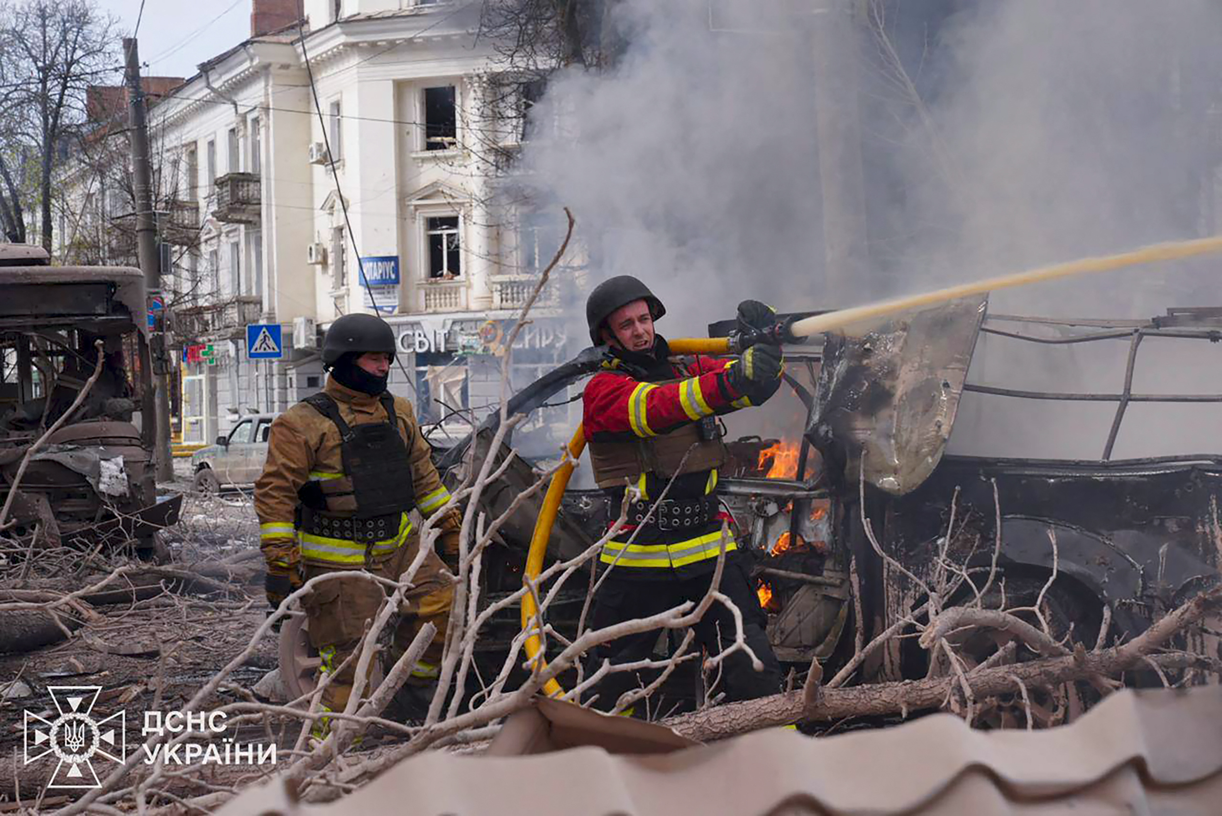 In this handout photograph taken and released by the Ukrainian Emergency Service on April 13, 2025, a Ukrainian rescuers work to extinguish a fire at the site of a missile attack in Sumy, northeastern Ukraine, amid the Russian invasion of Ukraine.