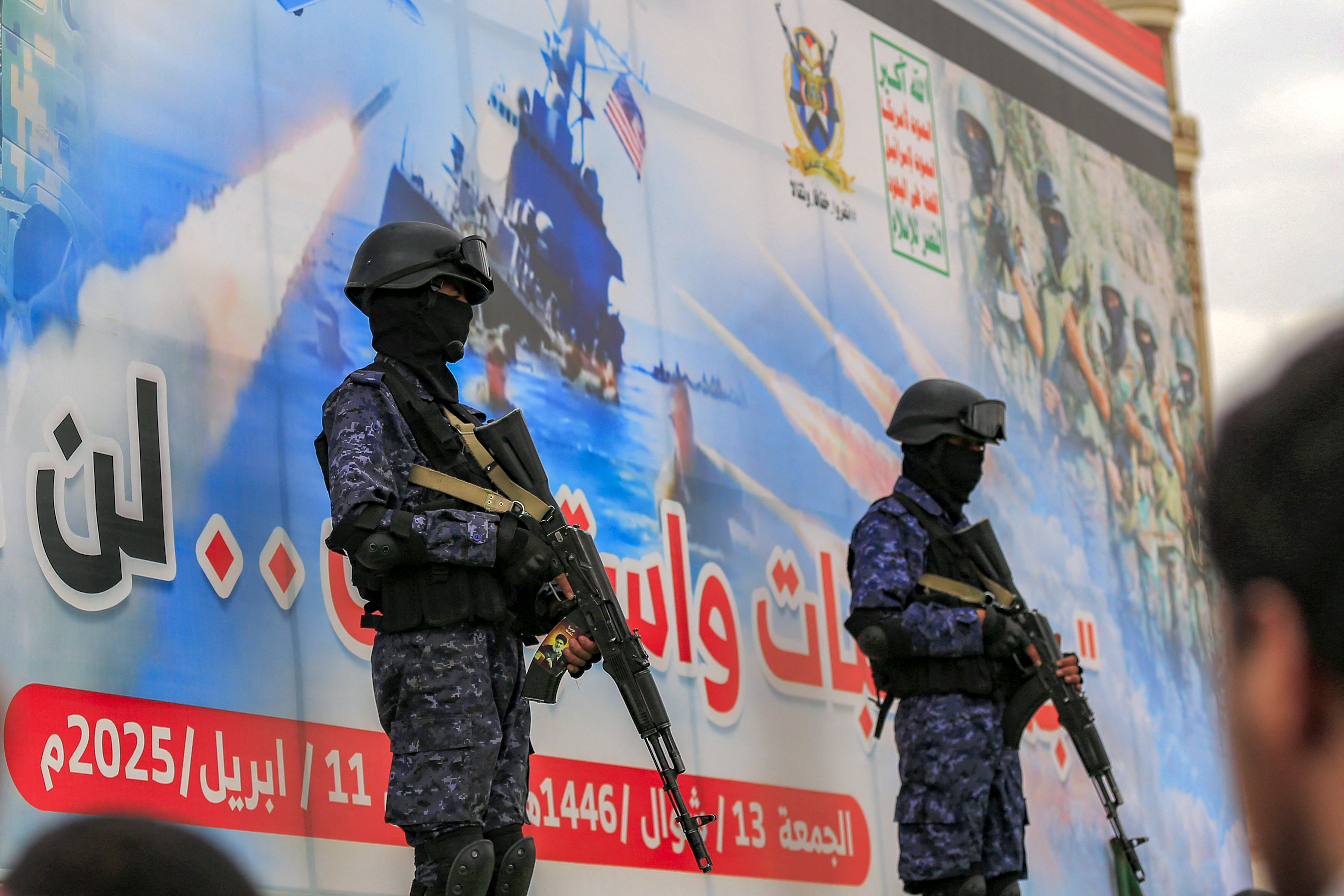 Members of Houthi-affiliated security forces stand guard during a rally in solidarity with Palestinians in the Gaza Strip and in condemnation of US strikes, in Yemen’s Houthi-controlled capital Sanaa on April 11, 2025 [AFP]