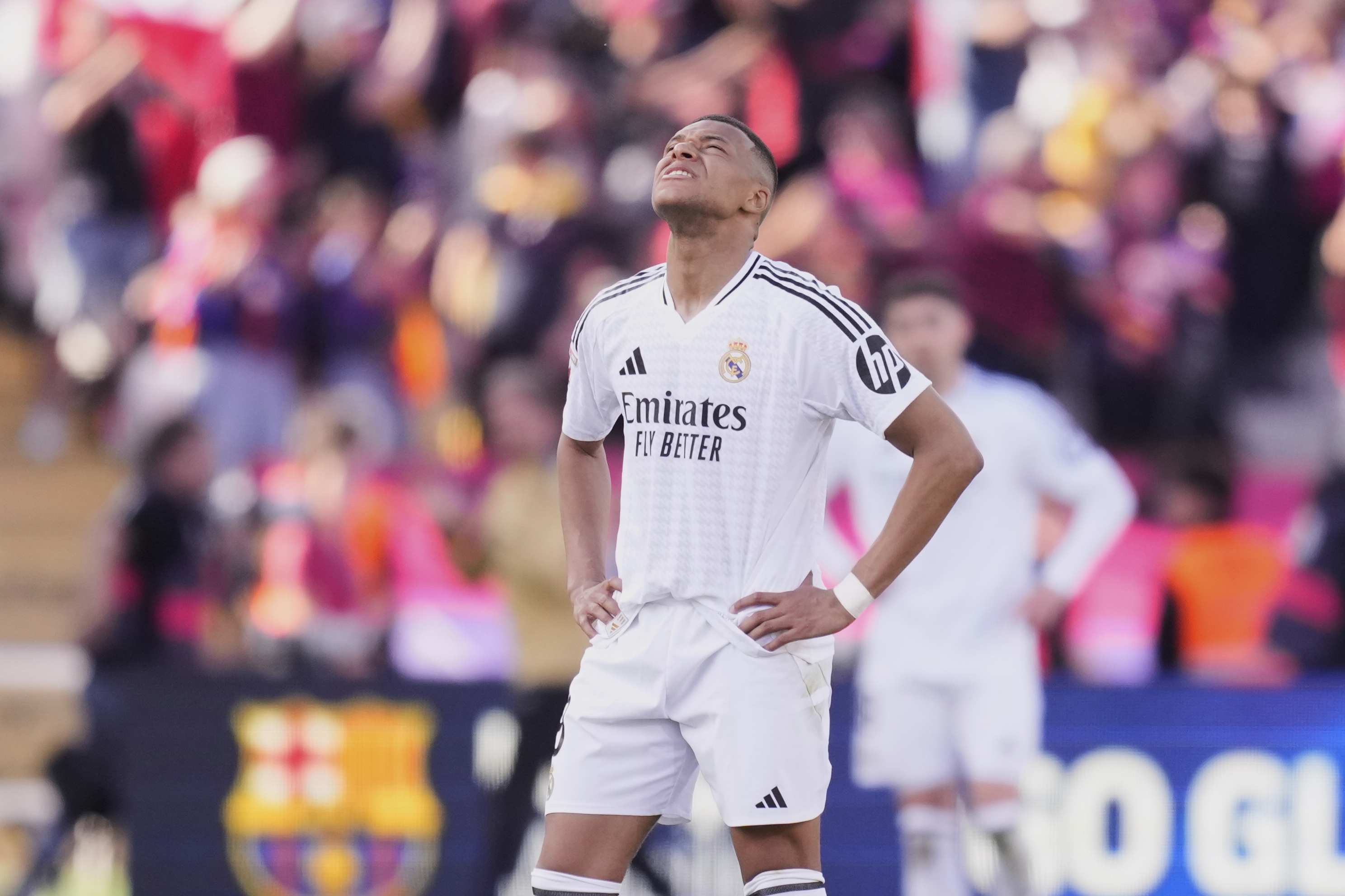 Real Madrid's Kylian Mbappe reacts during the Spanish La Liga soccer match between Barcelona and Real Madrid at the Lluis Companys Olympic Stadium in Barcelona, Spain, Sunday, May 11, 2025. (AP Photo/Jose Breton)
