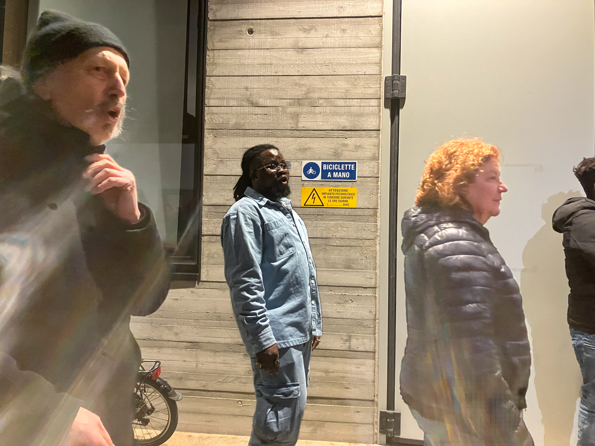 Prince vocalizing as the choir moves past him, in a kind of procession, during a recent performance. [Michela Moscufo/Al Jazeera]