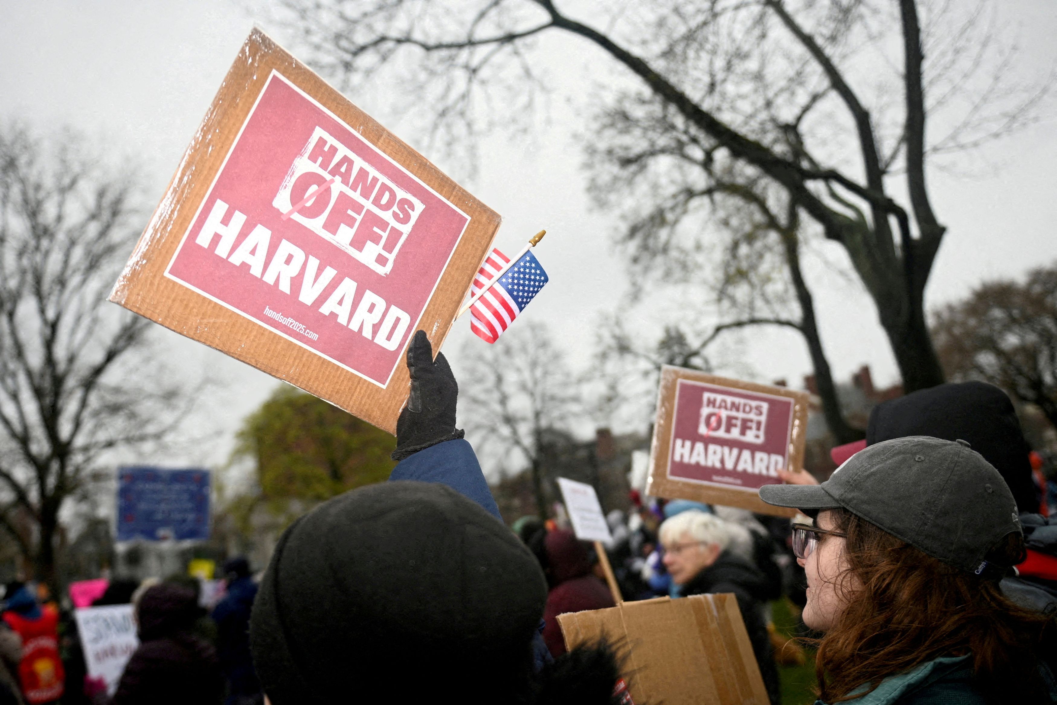 FILE PHOTO: Demonstrators rally on Cambridge Common in a protest organized by the City of Cambridge against interference by the federal government, in Cambridge