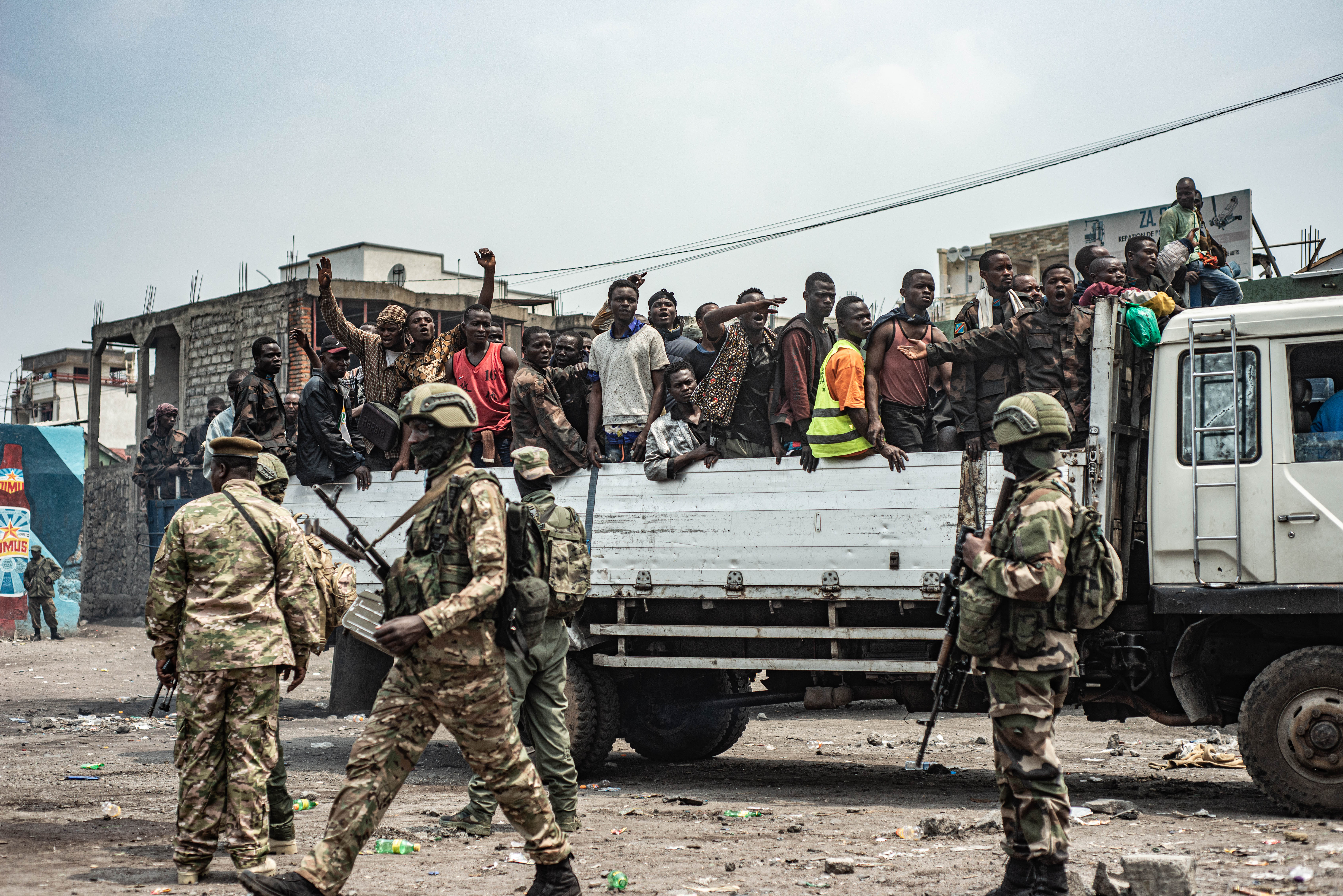 GOMA, DEMOCRATIC REPUBLIC OF CONGO - JANUARY 30: Detained FARDC soldiers are loaded onto trucks, to be taken to an unknown location, as an estimated 2400 Congolese (FARDC) soldiers surrendered en masse to M23 forces at the Stade de l'Unite on January 30, 2025 in Goma, Democratic Republic of Congo. The Rwanda-backed M23 rebel group has seized control Goma, in Eastern Congo, and are reportedly advancing south. (Photo by Daniel Buuma/Getty Images)