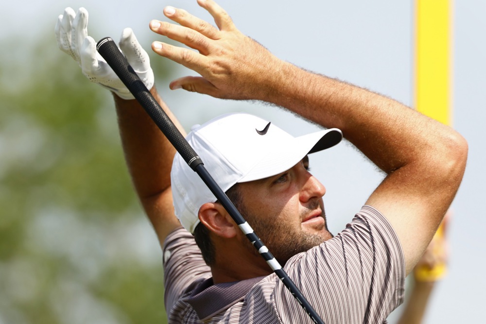 Scottie Scheffler of the US drops his club after teeing off on the 9th hole during the first round of the 2025 US Open golf tournament