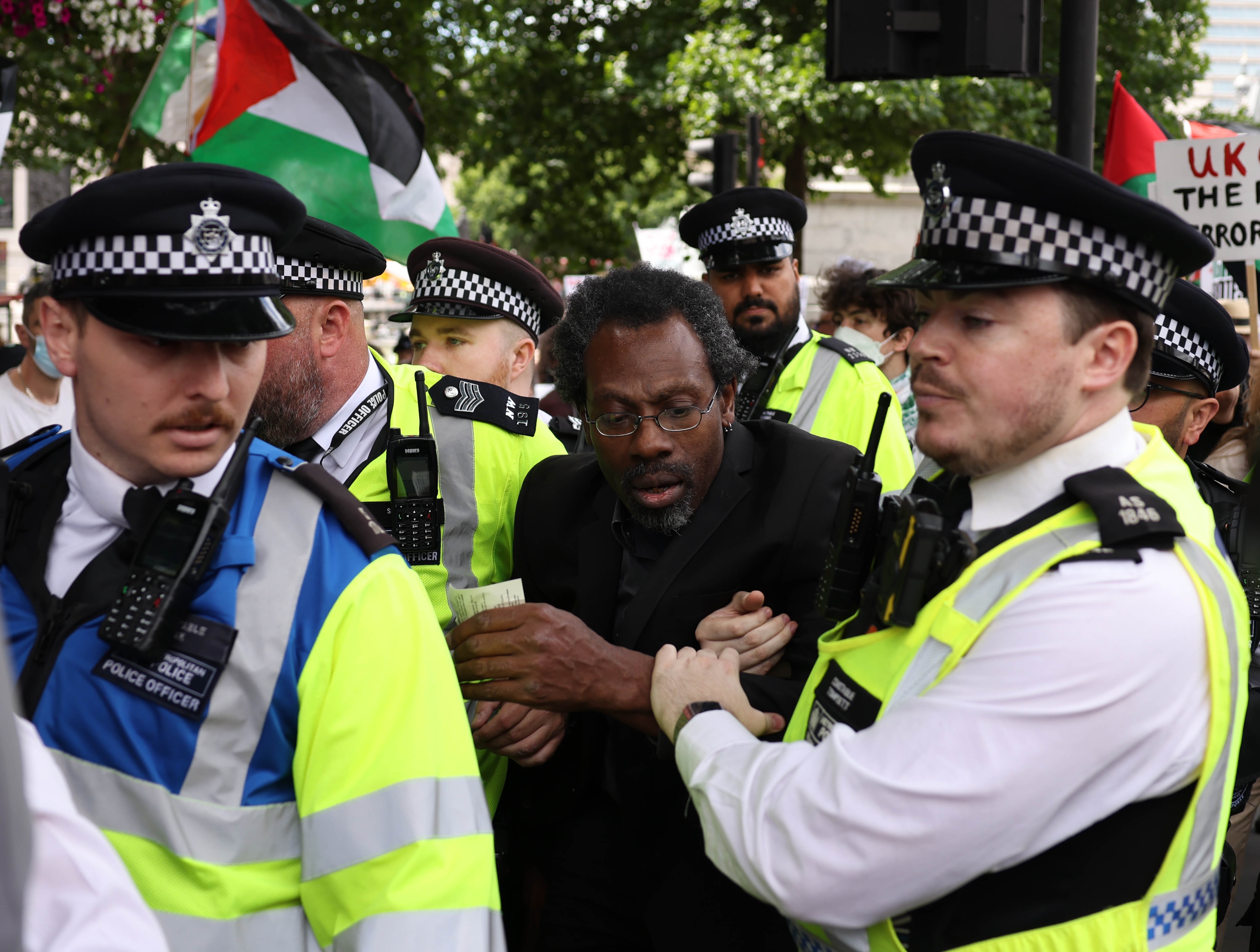Police officers remove a protestor during a demonstration in support of Palestine Action in Trafalgar Square, London, Britain on June 23, 2025.
