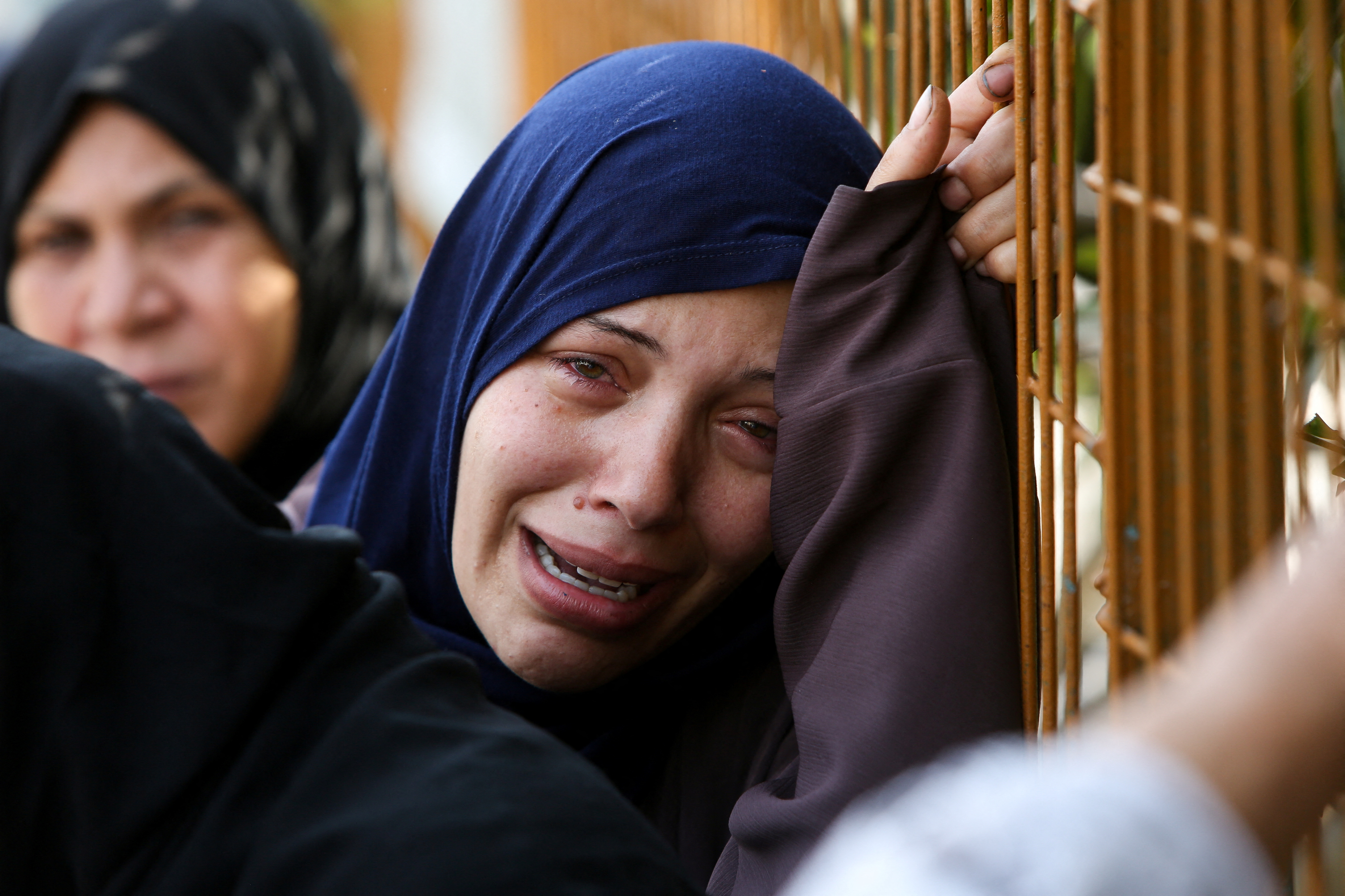 A woman mourns during the funeral of Palestinians killed in Israeli attacks