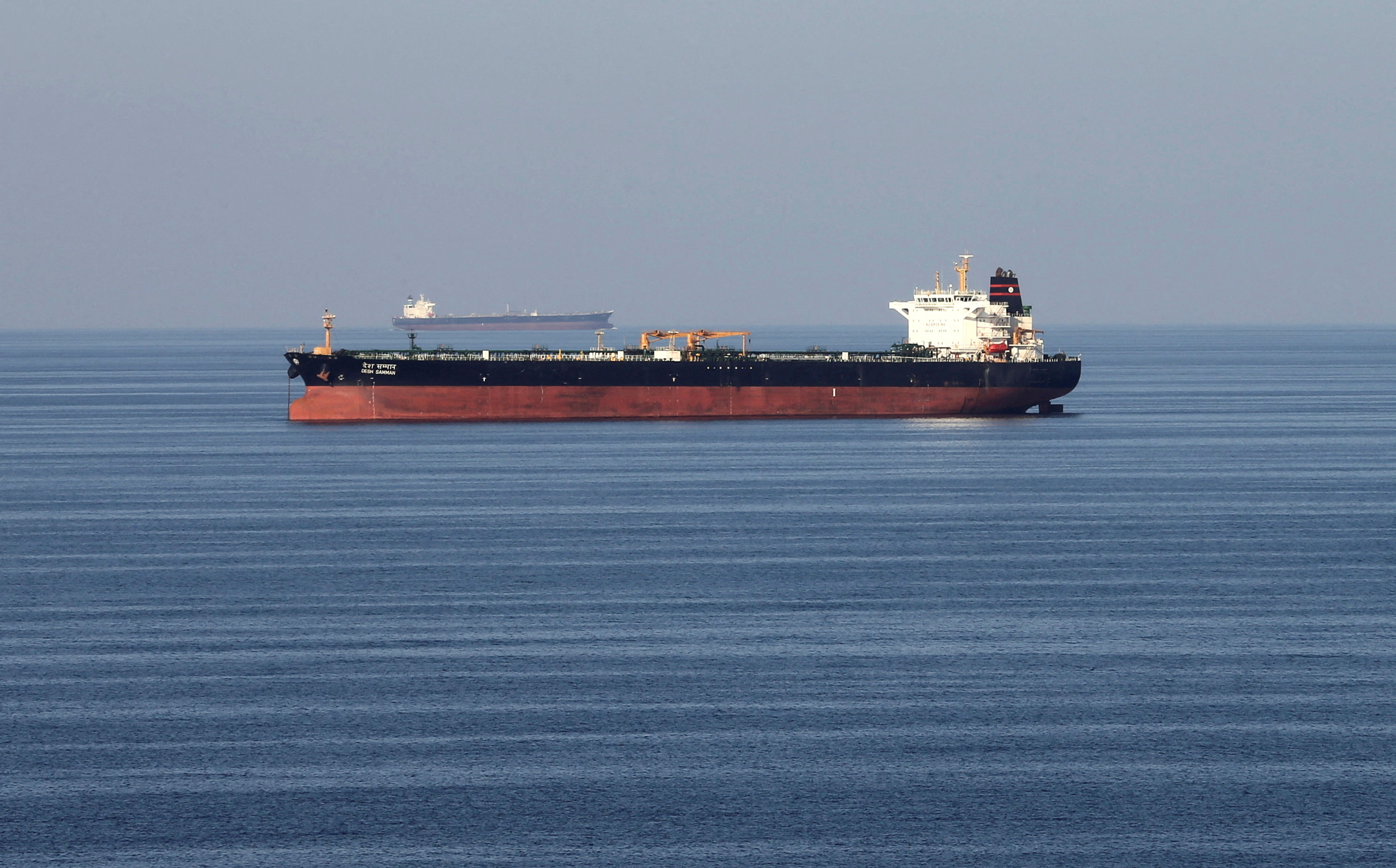 Oil tankers pass through the Strait of Hormuz [Hamad I Mohammed/Reuters]