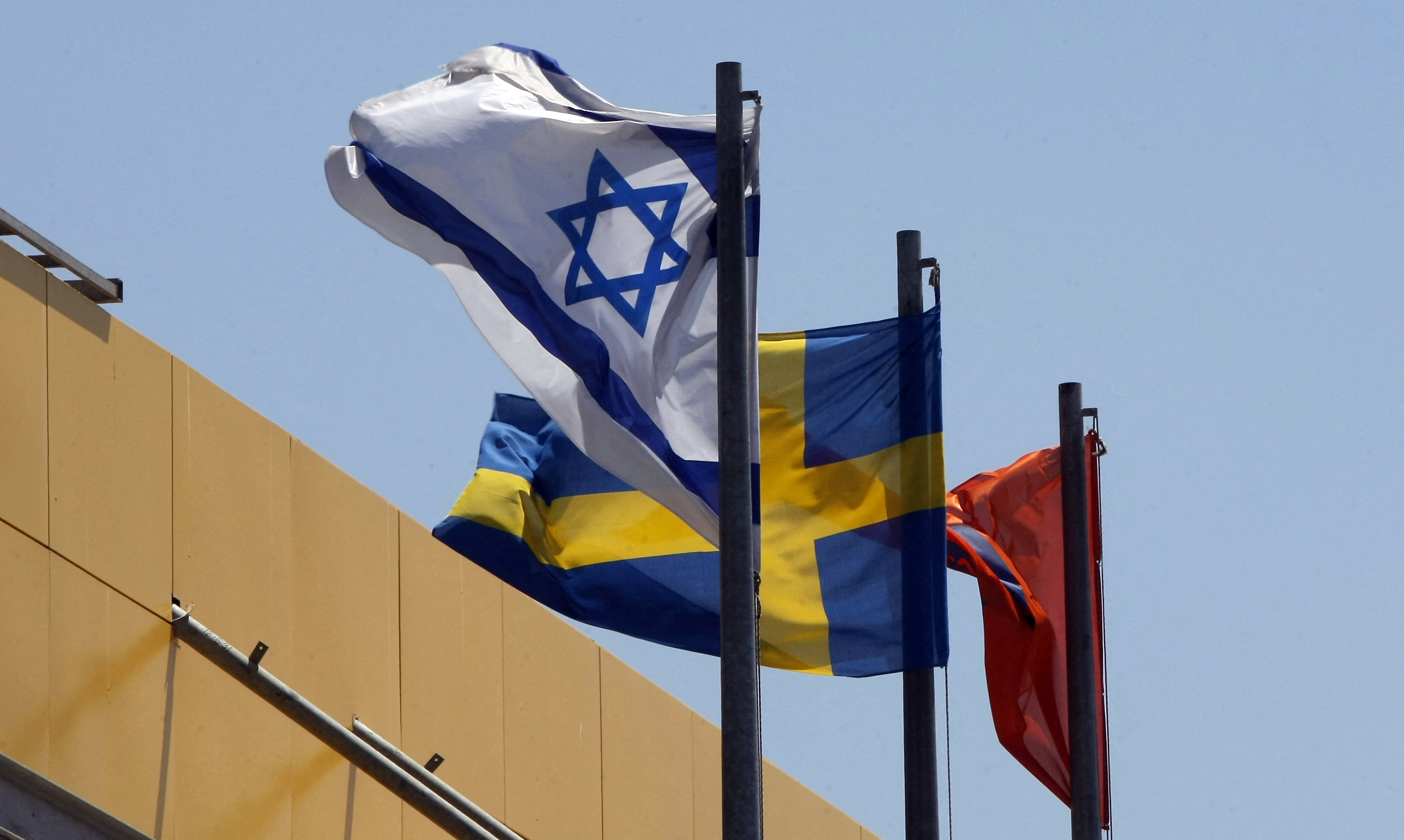Israeli and Swedish flags flutter in front of Swedish retail giant IKEA.