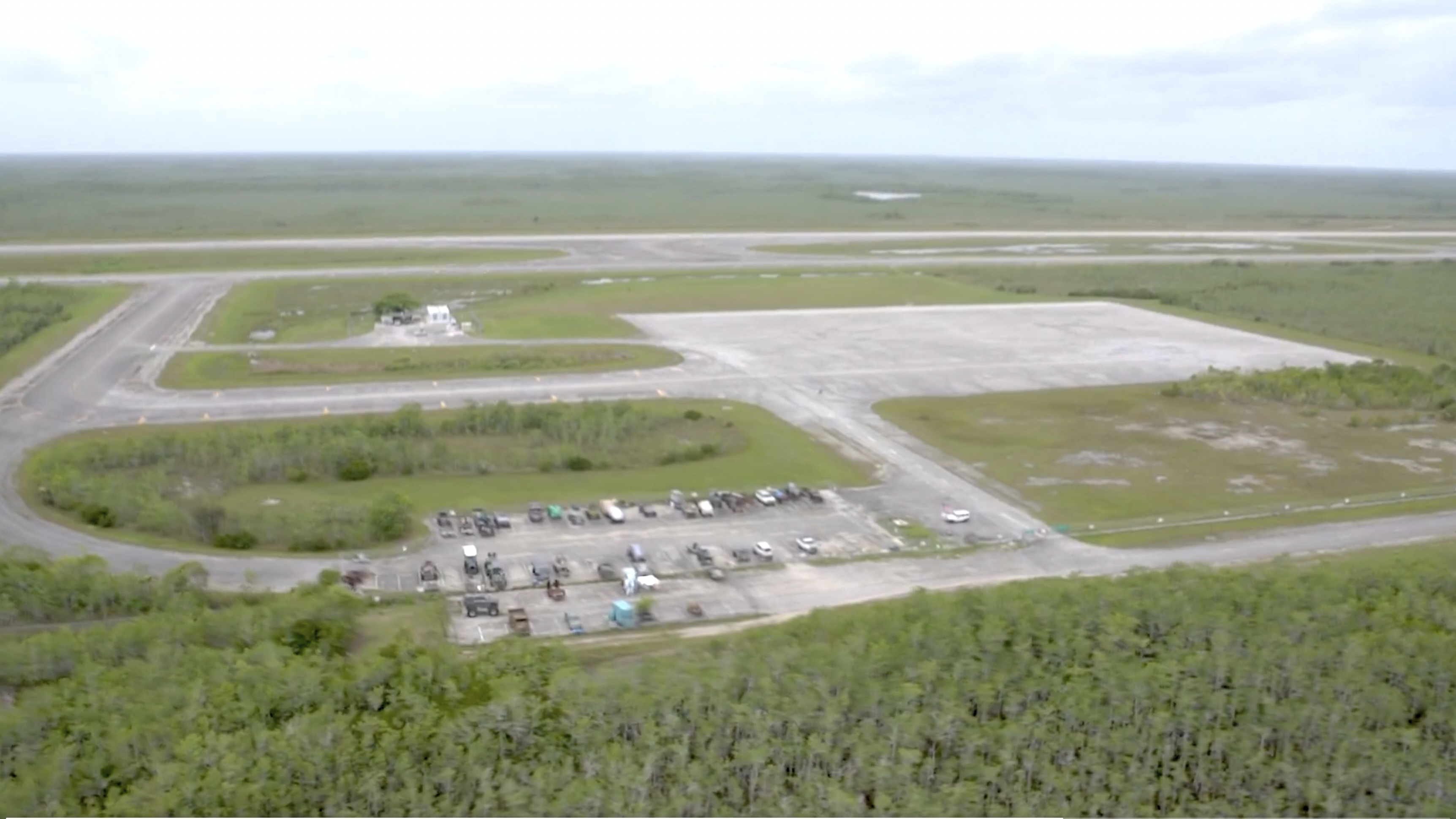 Aerial view of isolated Everglades airfield.