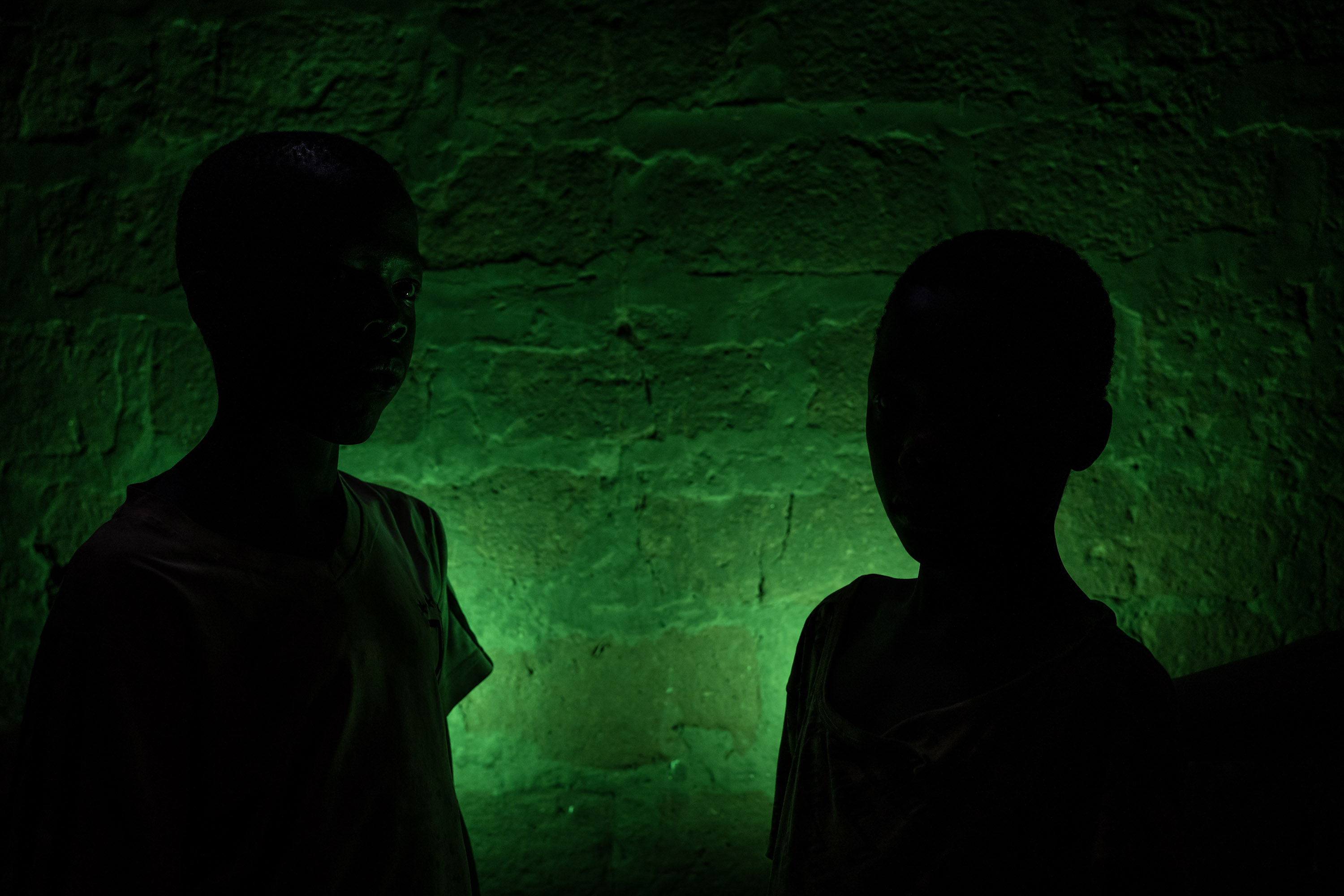 Ismael, 13 years old, and Estebao, 10 years old, pose for a photo inside their new home.
