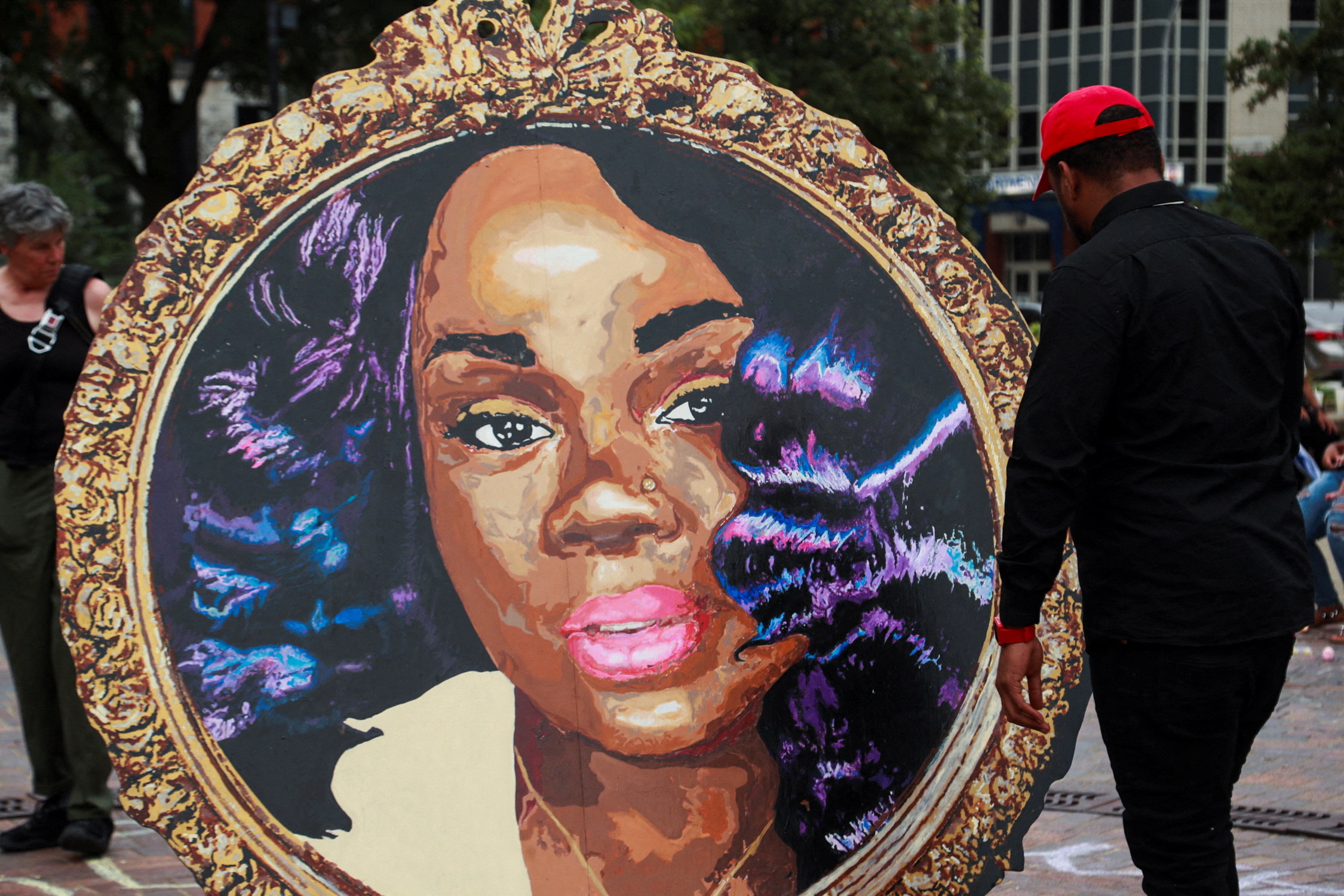 A painting of Breonna Taylor in a round frame