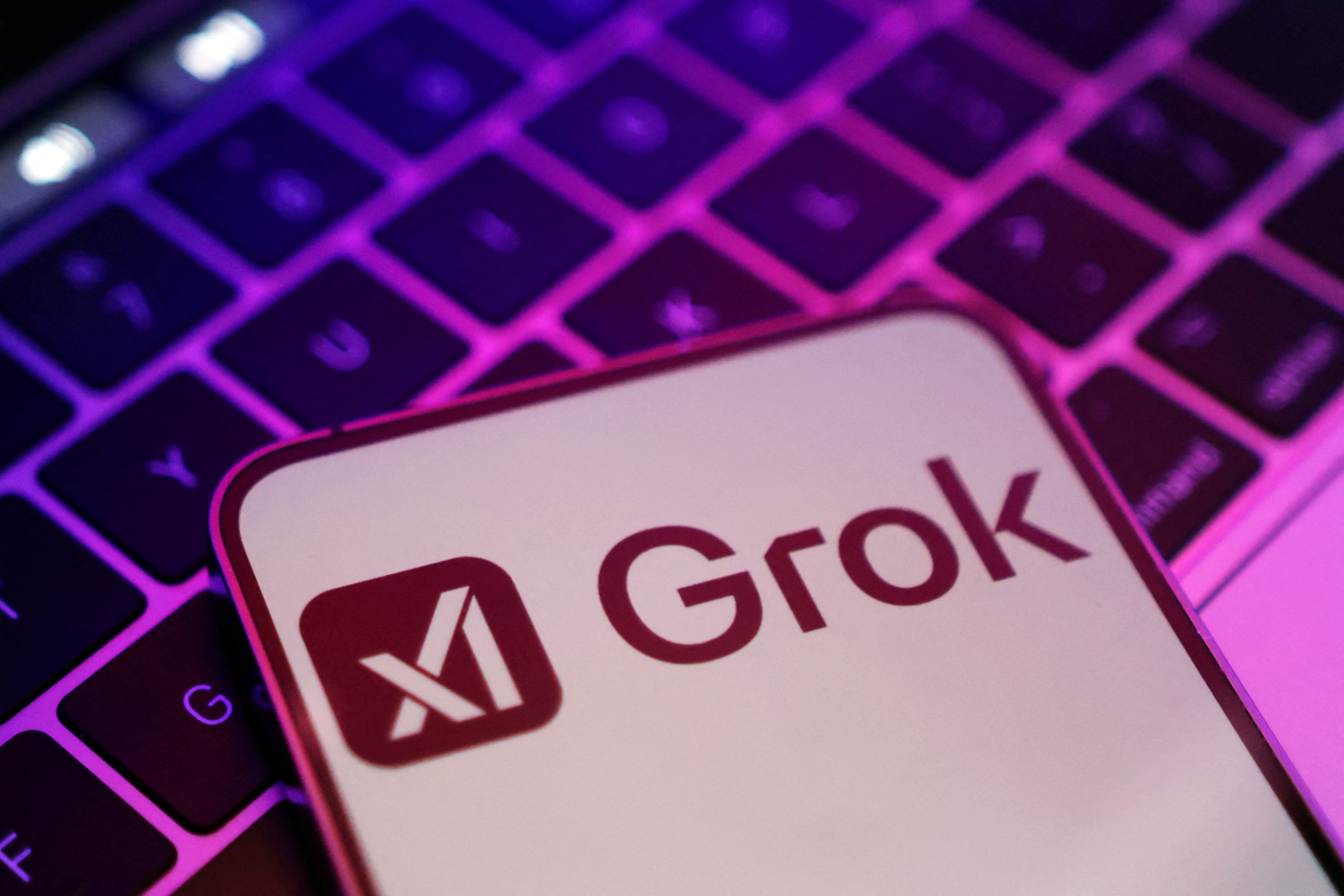 The logos of xAI and Grok are seen in this illustration taken February 16, 2025