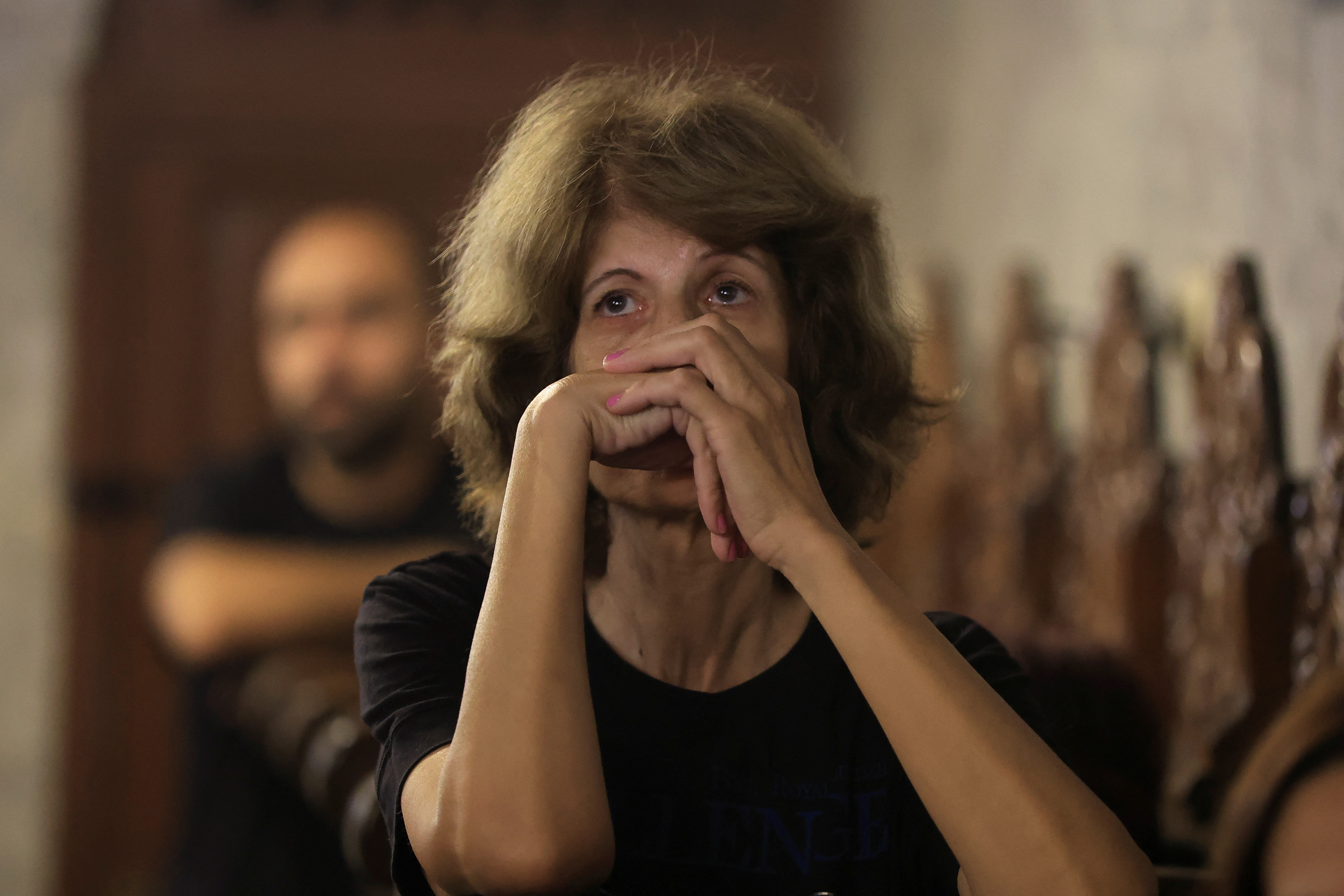 Mourners attend the funeral of two Palestinians killed in Israel's attack on a Gaza City church