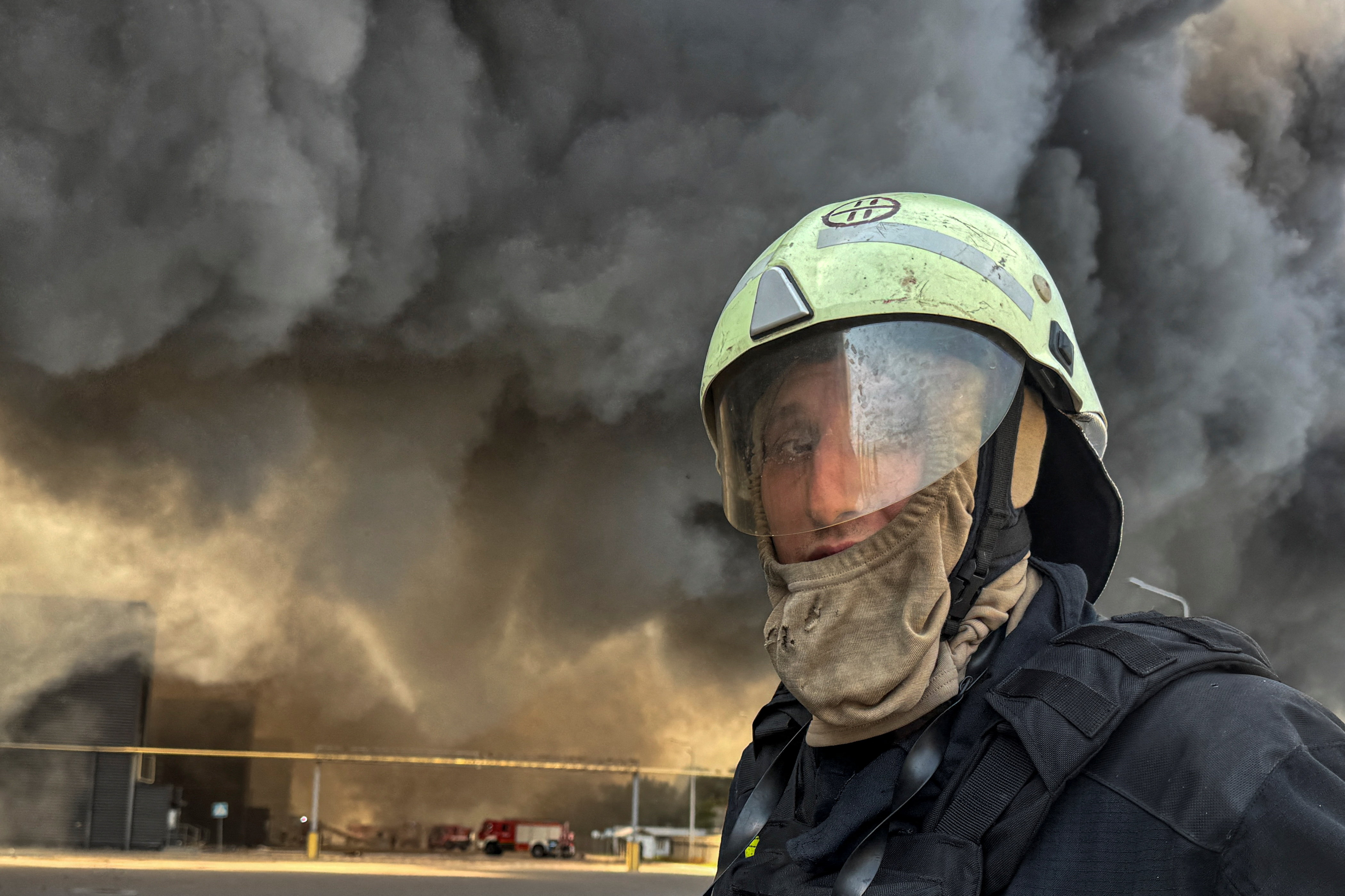 A firefighter works at the site of a food warehouse hit by a Russian military strike in the village of Vasyshcheve, amid Russia's attack on Ukraine, outside of Kharkiv, Ukraine July 30, 2025. REUTERS/Vitalii Hnidyi