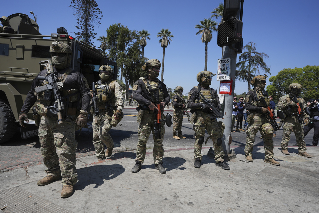 heavily armed US agents in a park