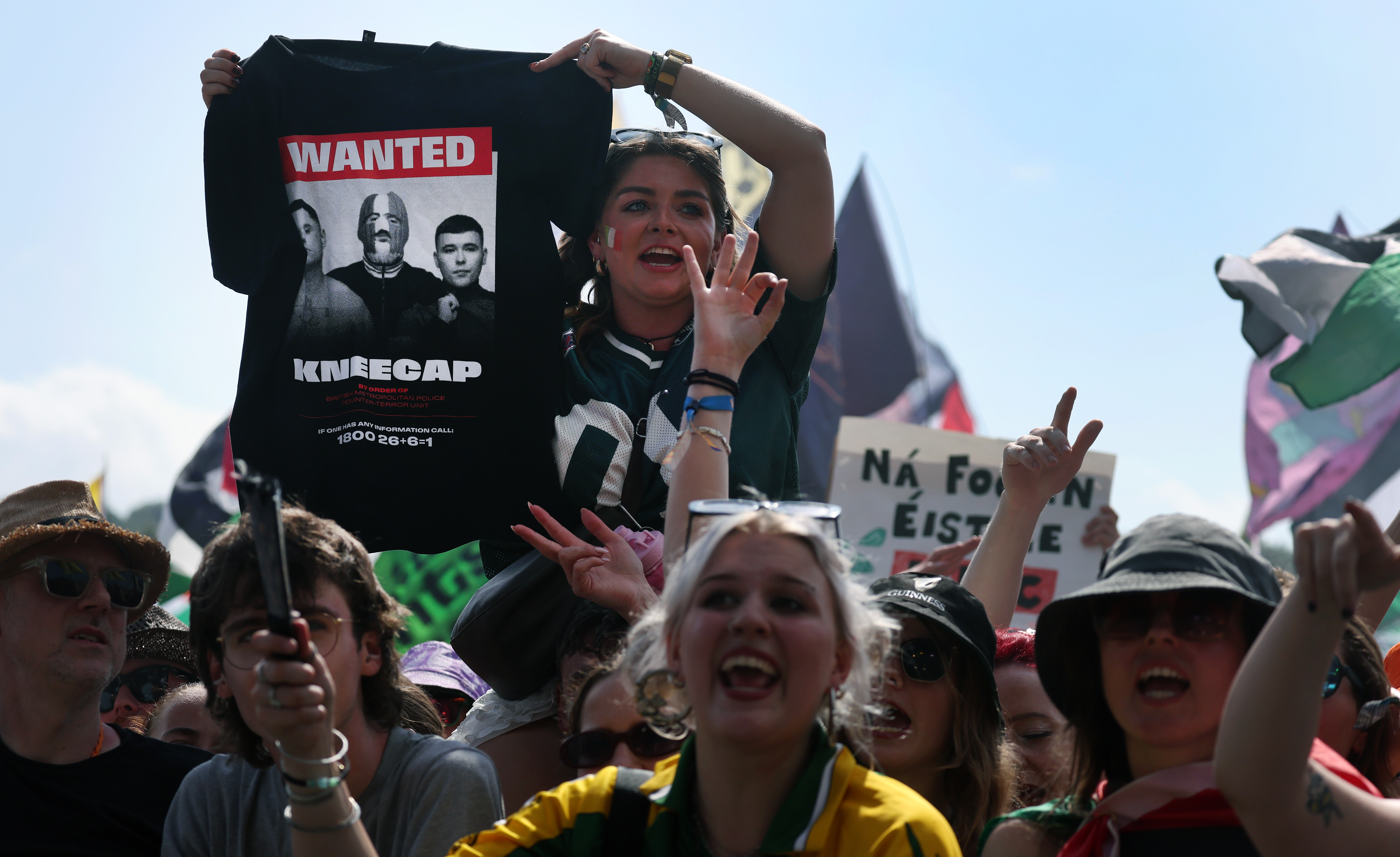 epa12203292 Kneecap fans watch Kneecap perform at the West Holts stage during day four of the Glastonbury Festival at Worthy Farm near Pilton, Somerset, Britain, 28 June 2025. The Glastonbury Festival of Contemporary Performing Arts 2025 runs from 25 to 29 June 2025. EPA/ANDY RAIN