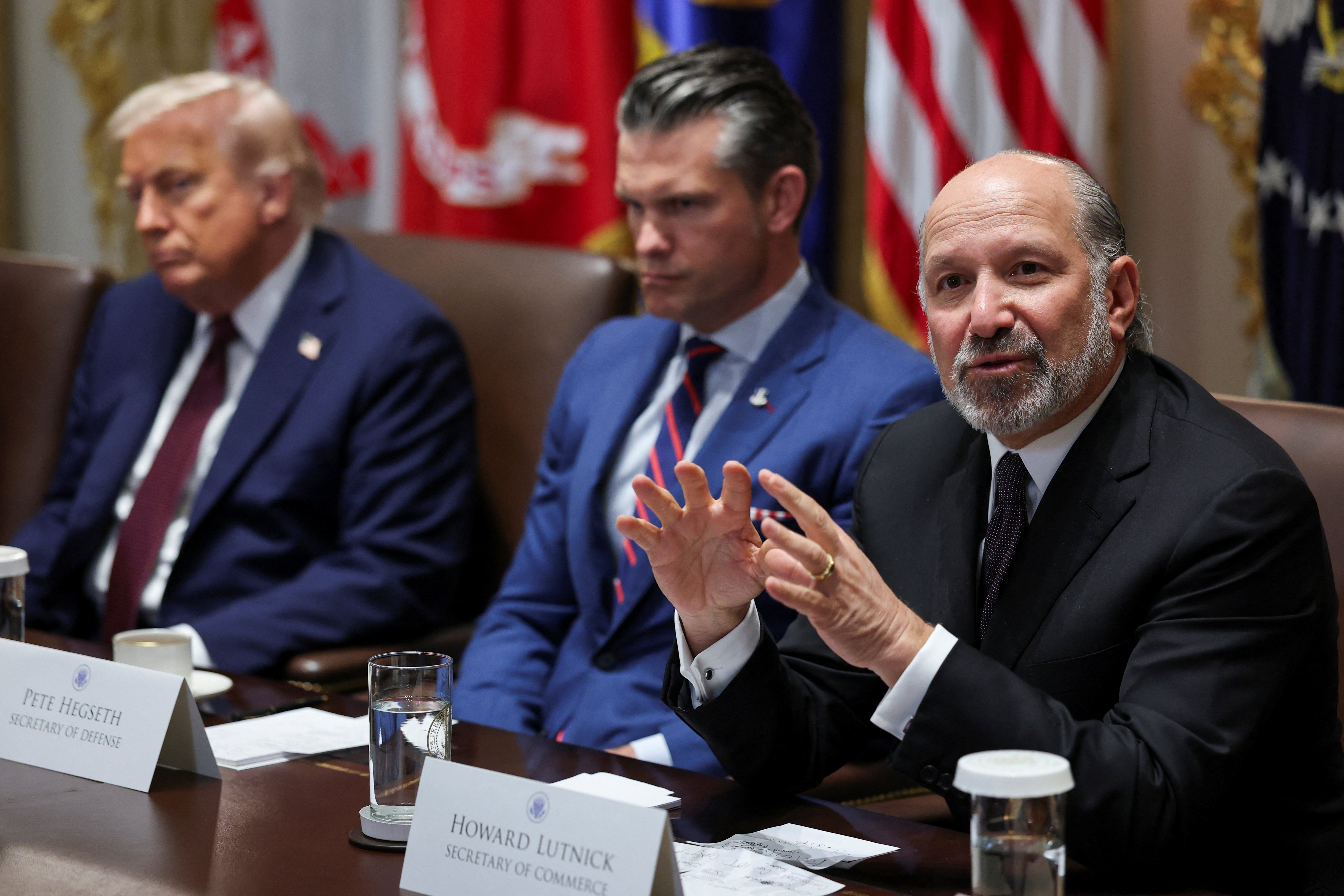 U.S. President Donald Trump, Defense Secretary Pete Hegseth and Secretary of Commerce Howard Lutnick attend a cabinet meeting at the White House in Washington, D.C., U.S., August 26, 2025. REUTERS/Jonathan Ernst