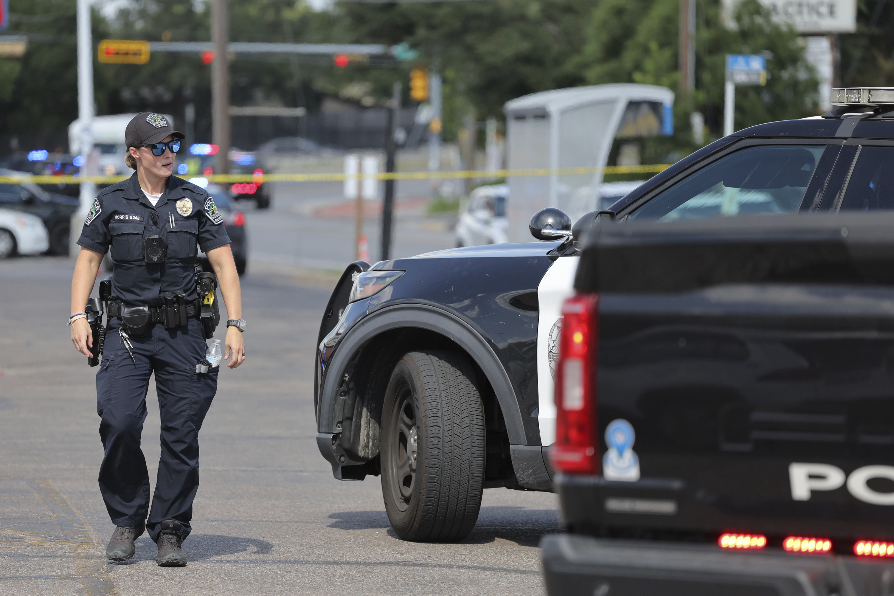 Police monitor the scene near a Target after a shooting in Austin, Texas
