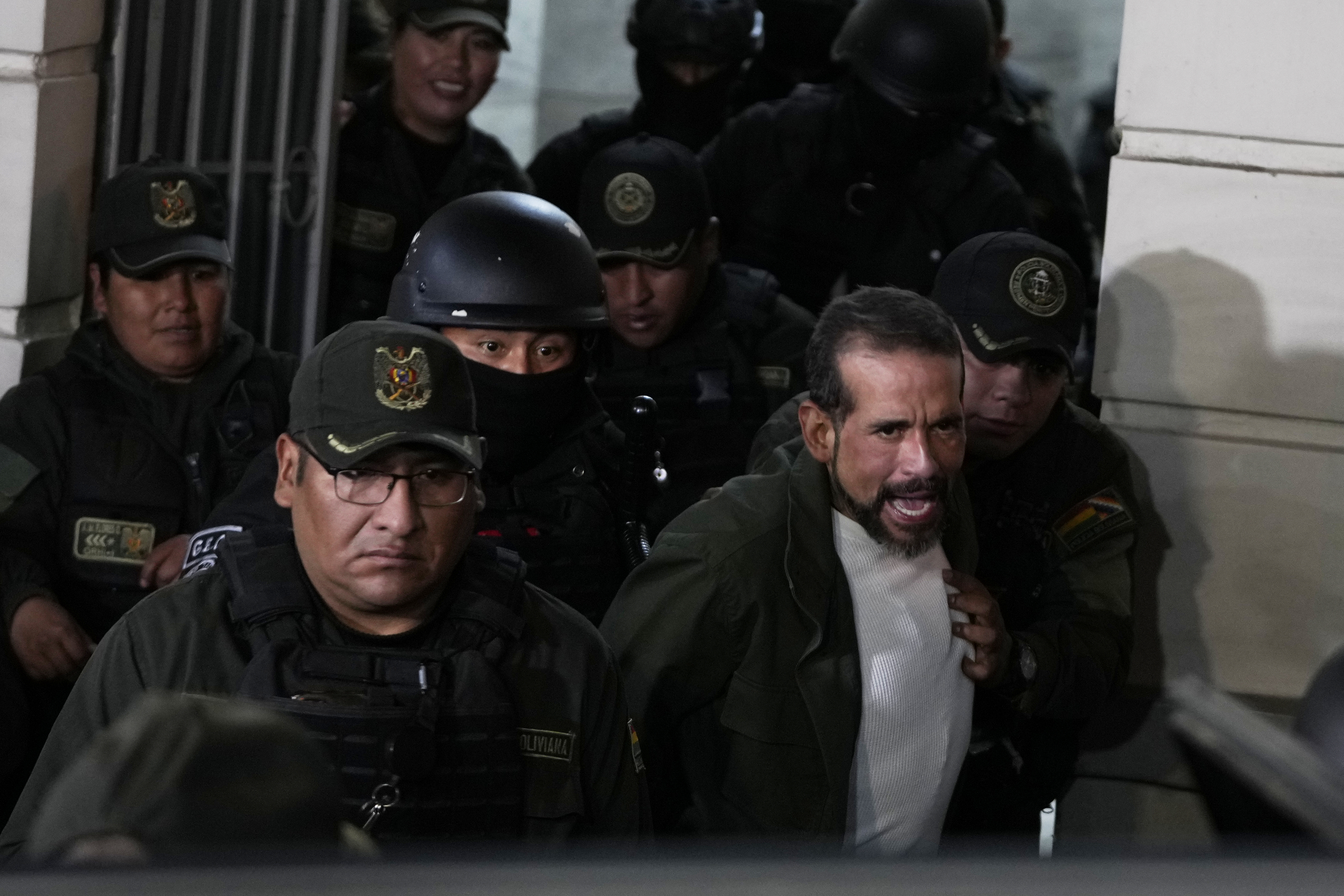 Luis Fernando Camacho leaves detention escorted by police