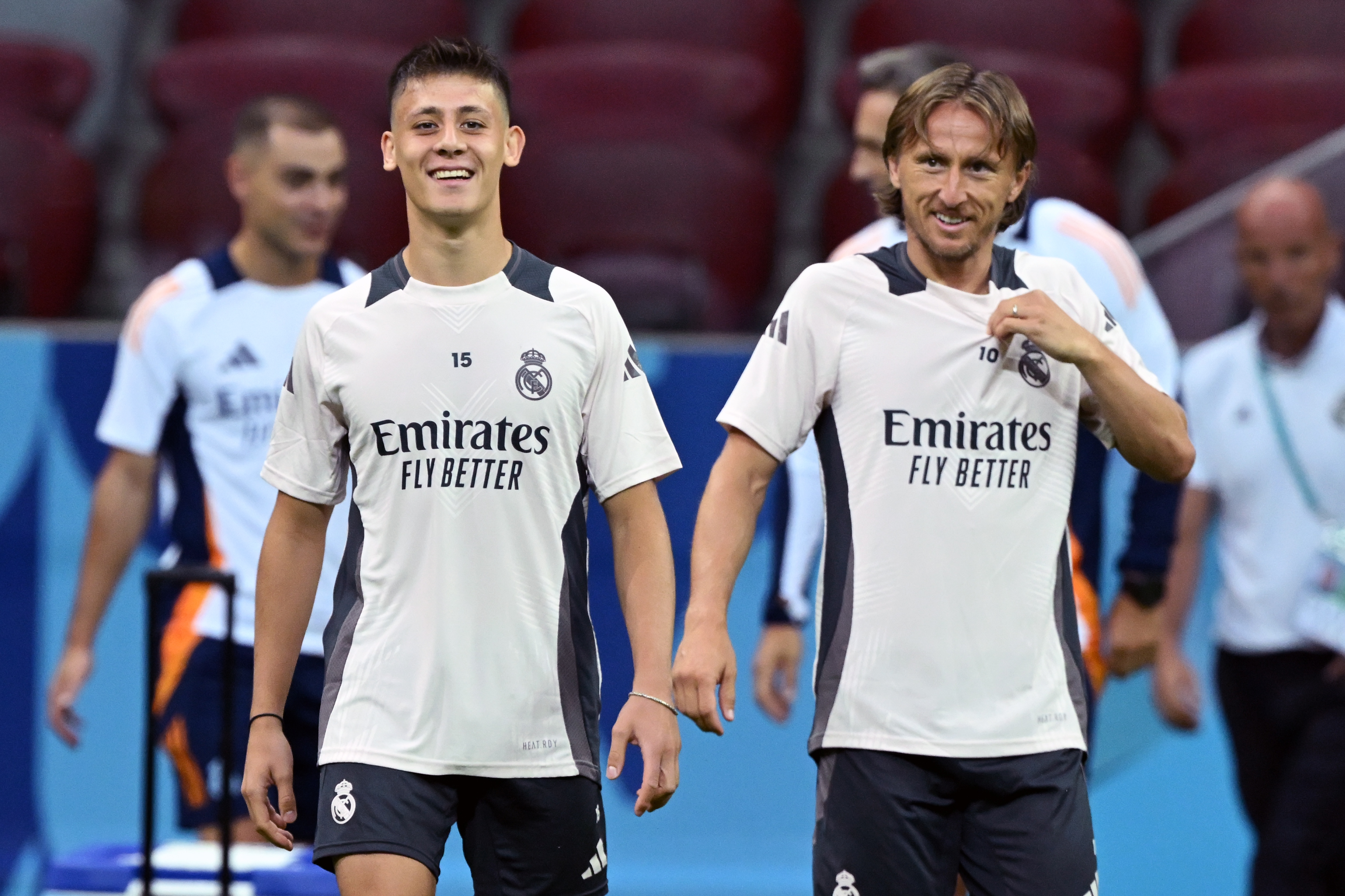 Arda Guler and Luka Modric react.