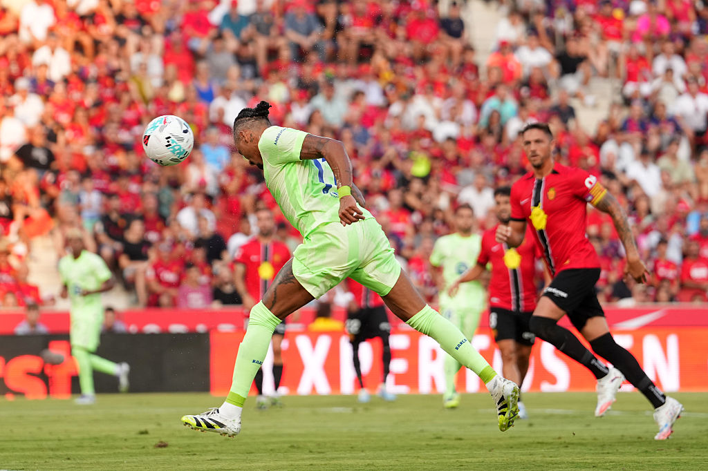 Barcelona's Brazilian forward Raphinha heads the ball to score a goal during the Spanish league football match at Mallorca