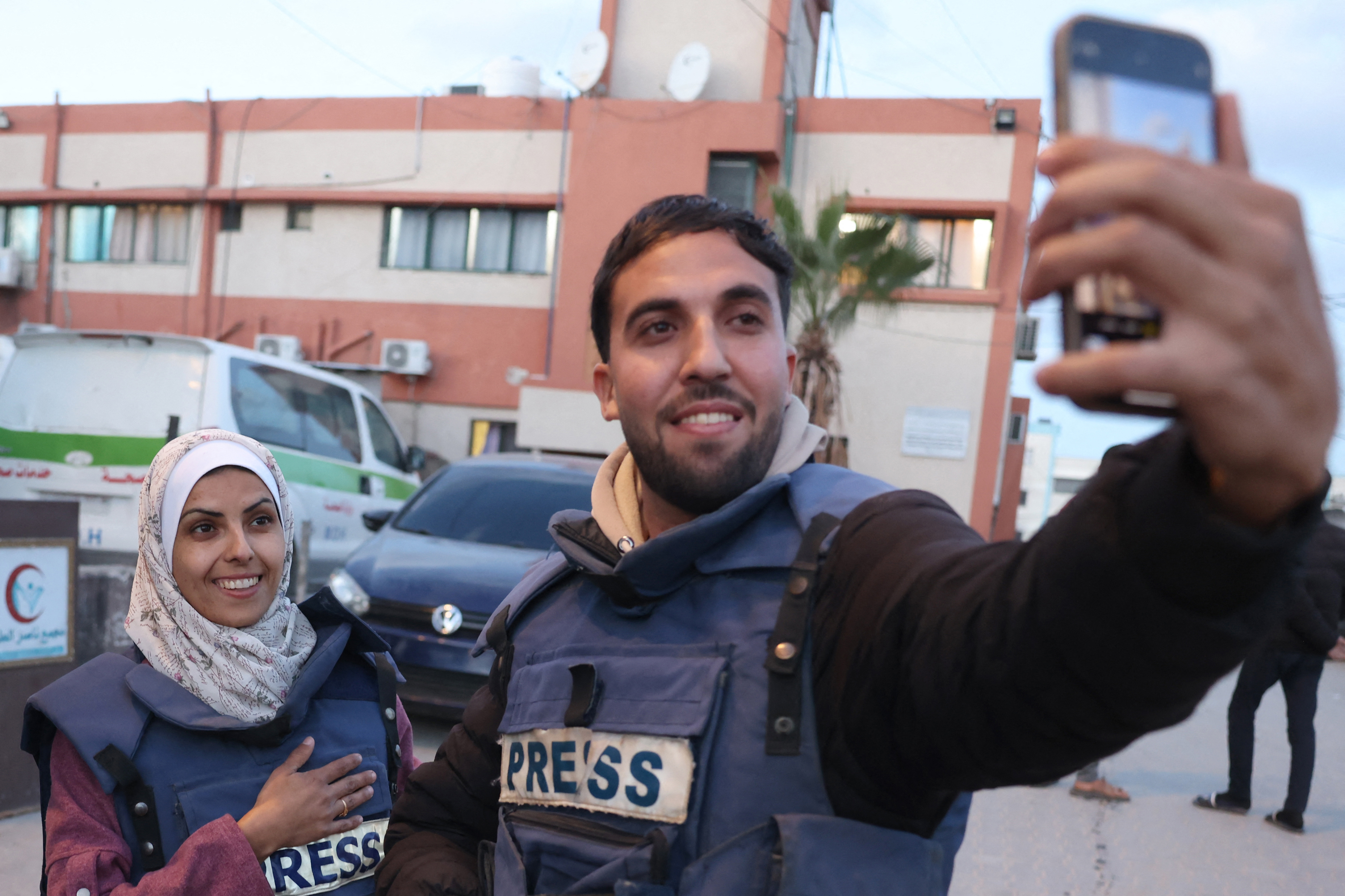 Moaz Abu Taha, a Palestinian journalist who had worked with some Palestinian and international outlets, takes a selfie with Mariam Dagga, a Palestinian visual journalist who freelanced for AP since the start of the war, in Khan Yunis in the southern Gaza Strip on January 18, 2025.