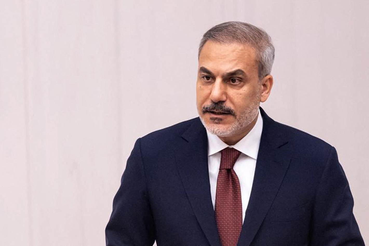 Turkiye's Foreign Minister Hakan Fidan giving a speech.