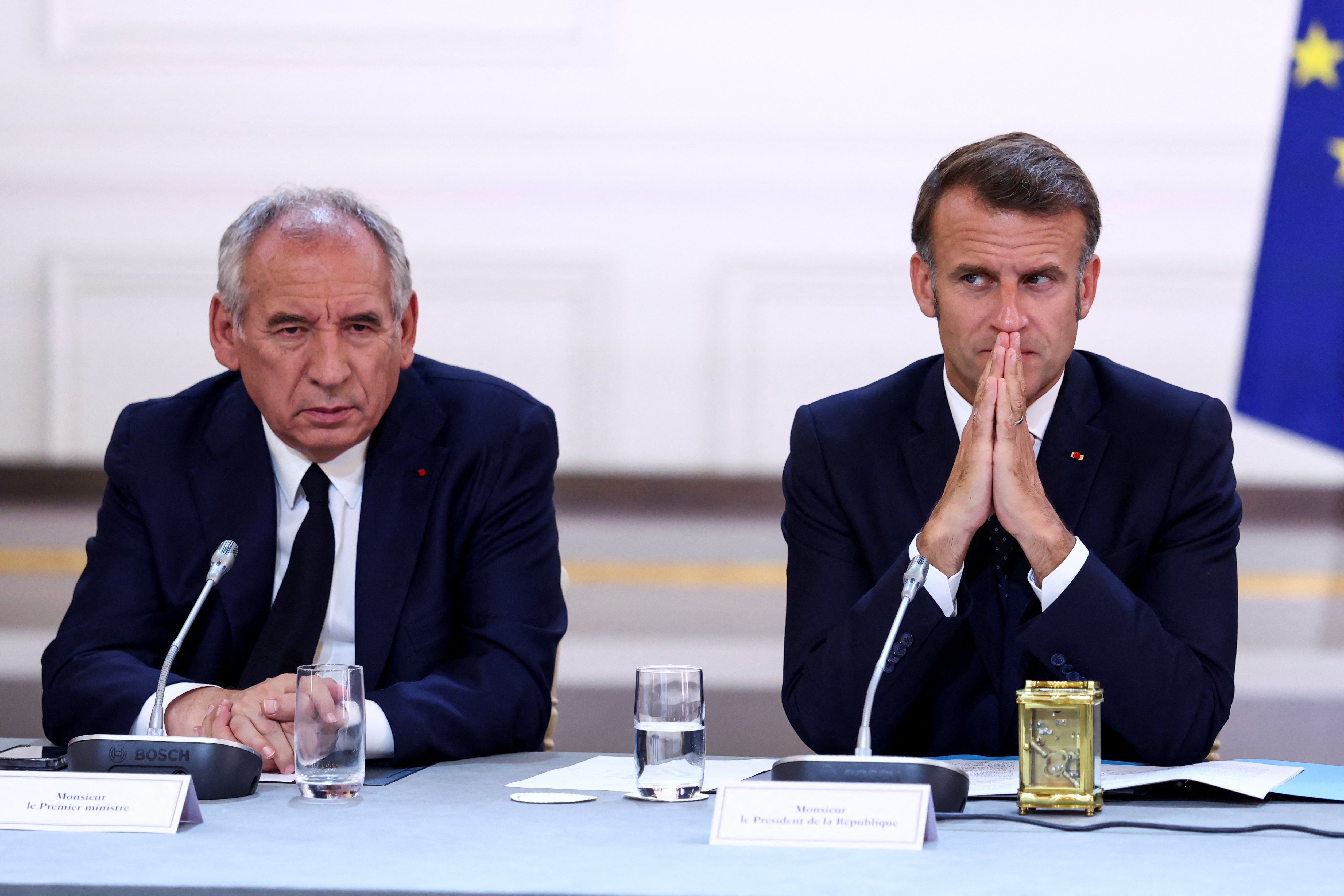 French President Emmanuel Macron and Prime Minister Francois Bayrou attend a meeting [File: Tom Nicholson/Reuters]