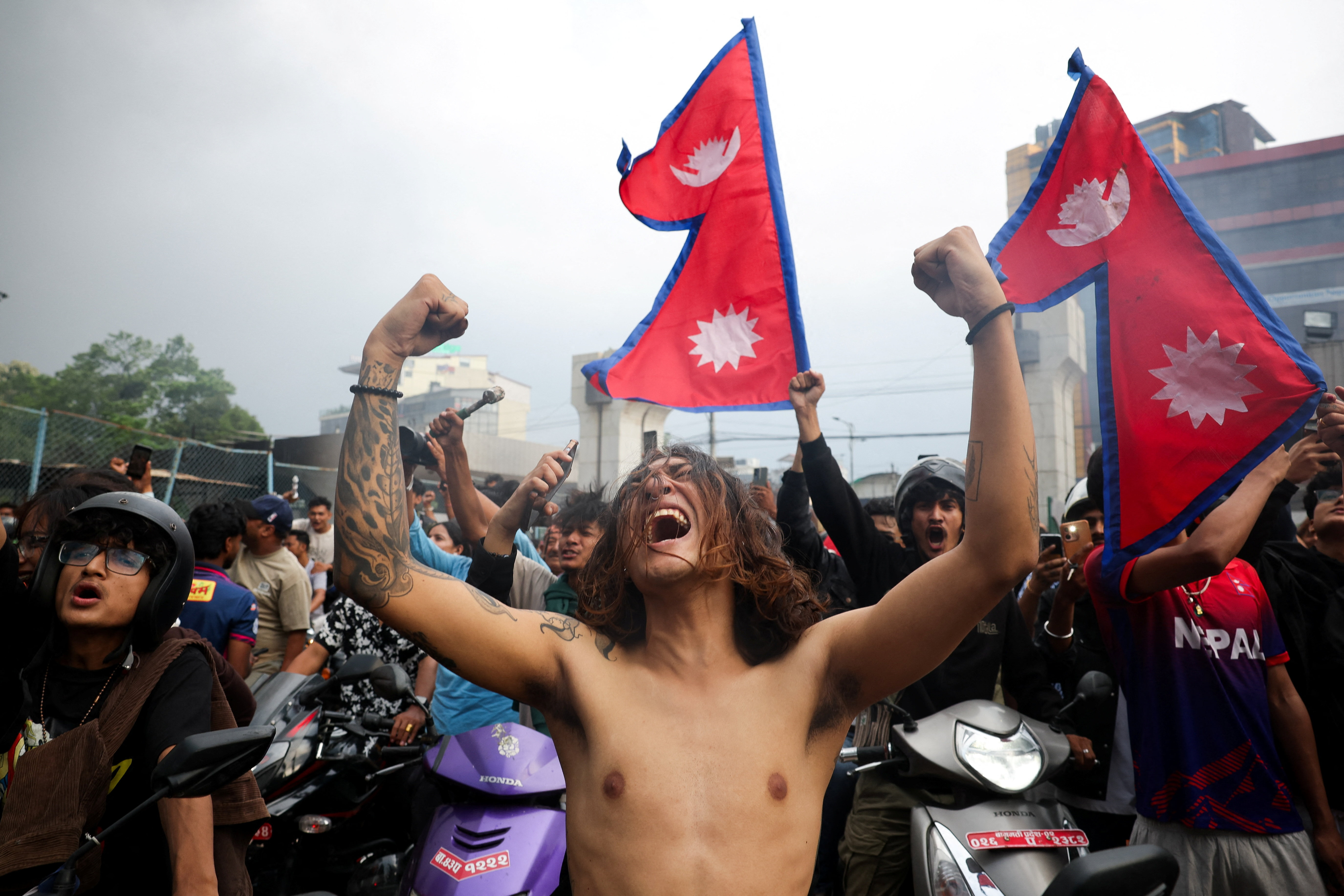 Protesters torch Nepal parliament as PM resigns amid turmoil