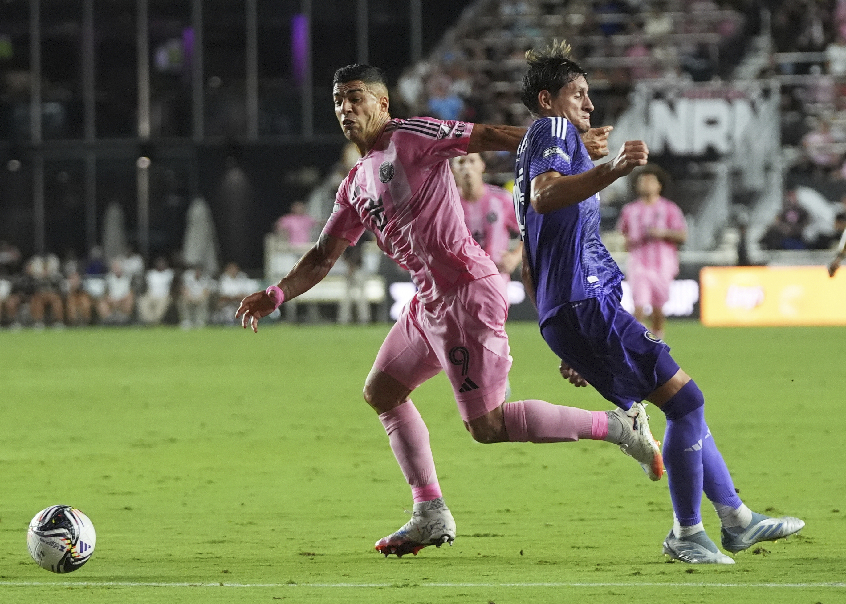 A video camera that was posted on social video appeared to show Inter Miami’s Luis Suarez, left, spitting on a Sounders staffer after the full-time whistle
