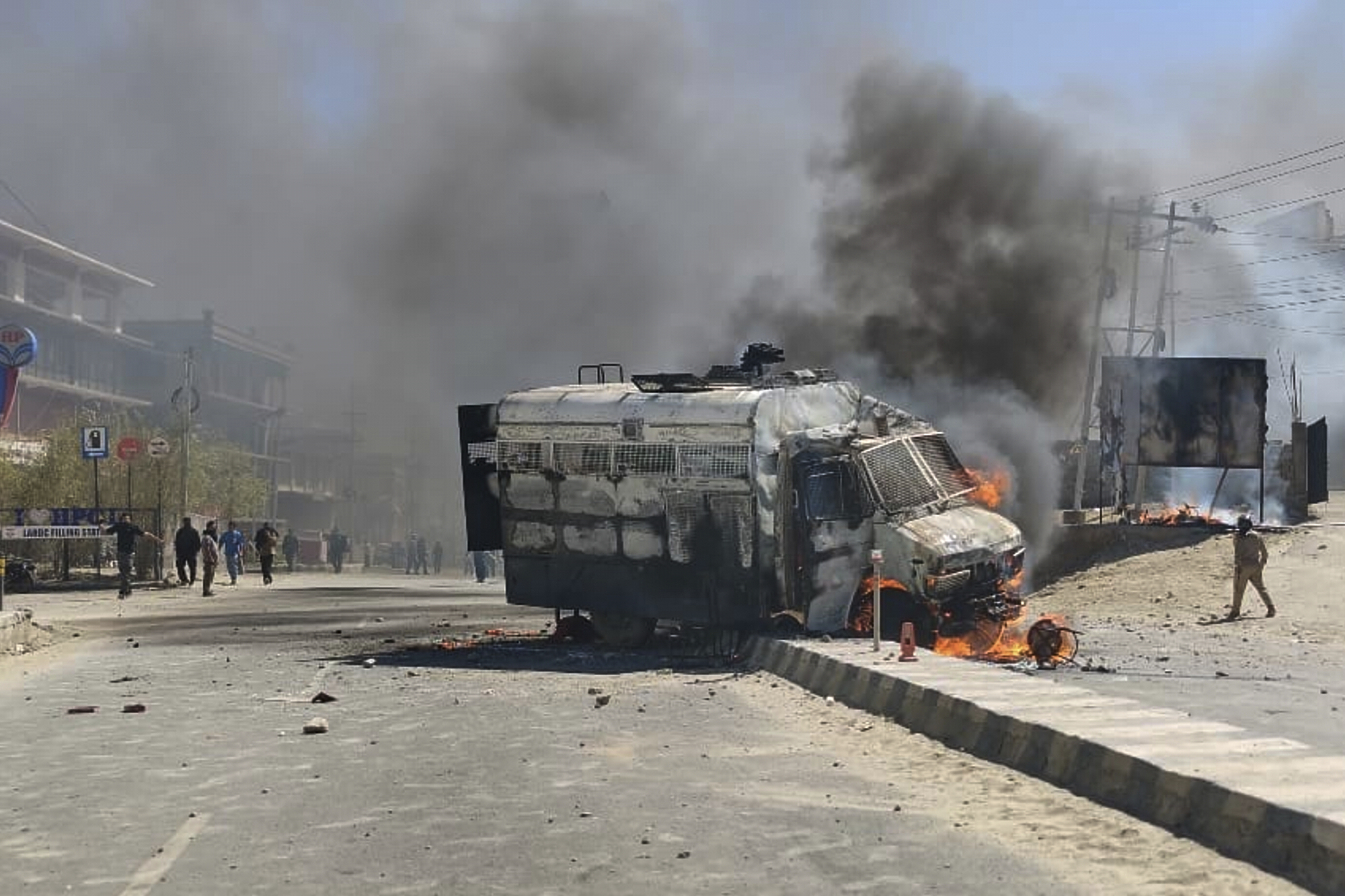 A police vehicle is set on fire during a protest by locals demanding statehood in the high-altitude Leh town, in the region of Ladakh, September 24, 2025 [AP Photo]