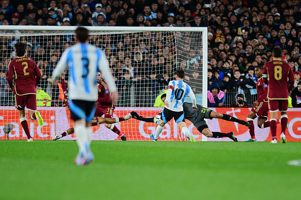 Lionel Messi of Argentina shoots to score the team's first goal during the South American FIFA World Cup 2026 Qualifier match between Argentina and Venezuela 