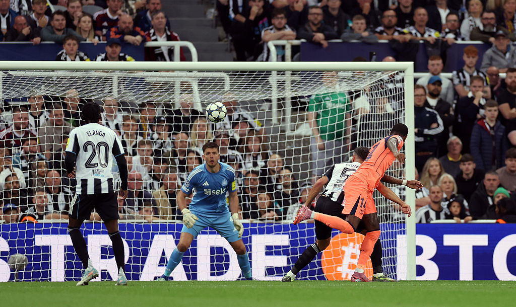 Marcus Rashford of Barcelona scores his team’s first goal past Nick Pope of Newcastle United
