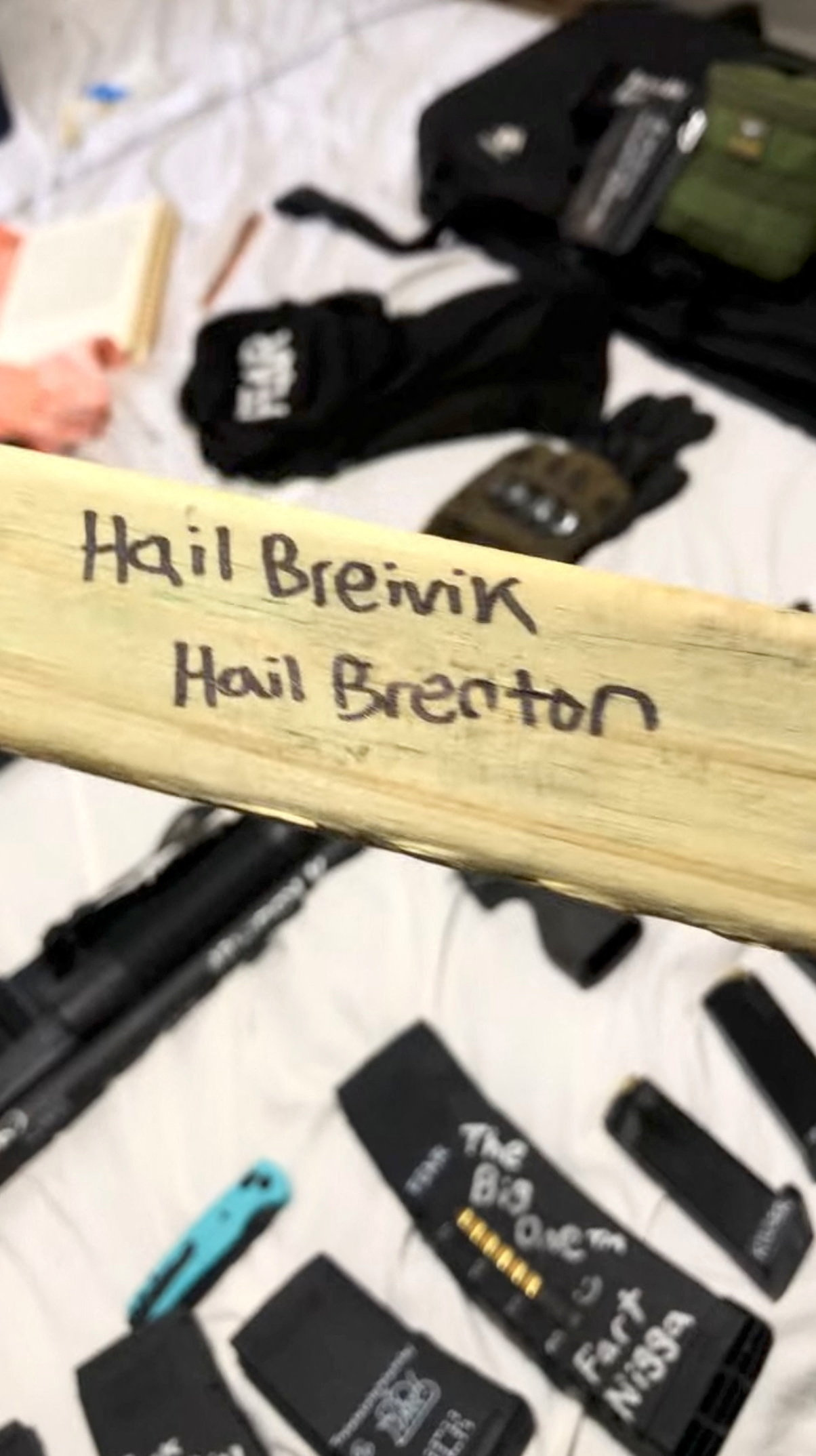 A piece of wood adorned with the names of Brenton Tarrant, who killed 51 people in New Zealand in a 2019 mass shooting, and Anders Breivik, who killed 80 people in Norway in 2011, appears in a still image from an undated video that was previously posted to social media and filmed by Robin Westman, identified by a law enforcement source as the suspected shooter in the Annunciation Church attack in Minneapolis. The video has since been removed. Robin Westman via YouTube/via REUTERS THIS IMAGE HAS BEEN SUPPLIED BY A THIRD PARTY. NO RESALES. NO ARCHIVES.