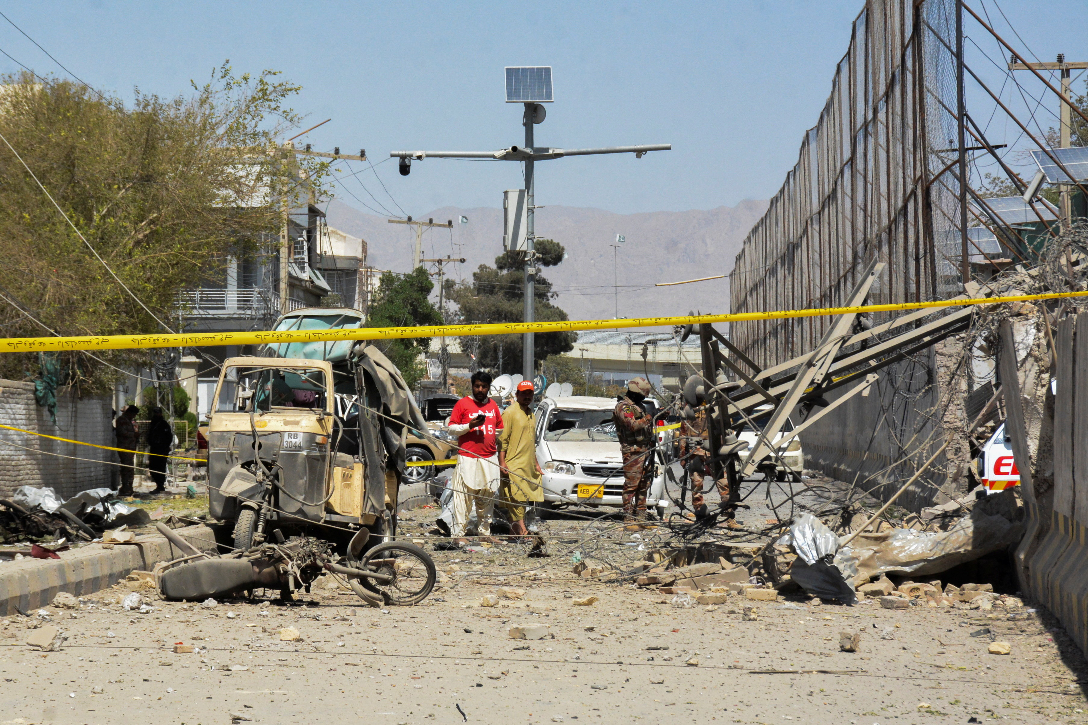 Paramilitary soldiers and rescue workers stand amid the debris after a bomb blast near the Frontier Corps headquarters in Quetta, Pakistan September 30, 2025. REUTERS/Stringer