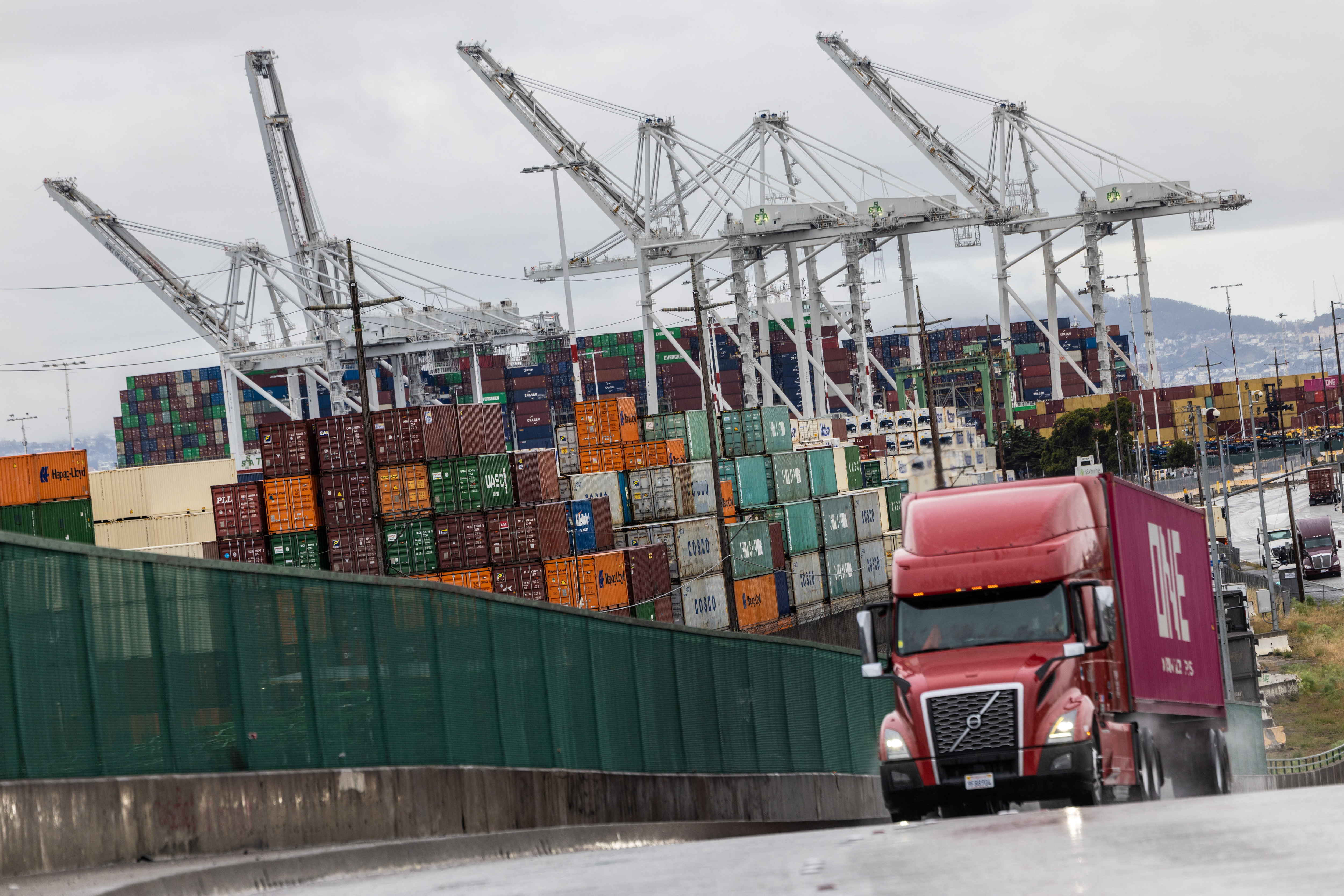 Shipping containers are seen at the port of Oakland, California [File: Carlos Barria/Reuters]