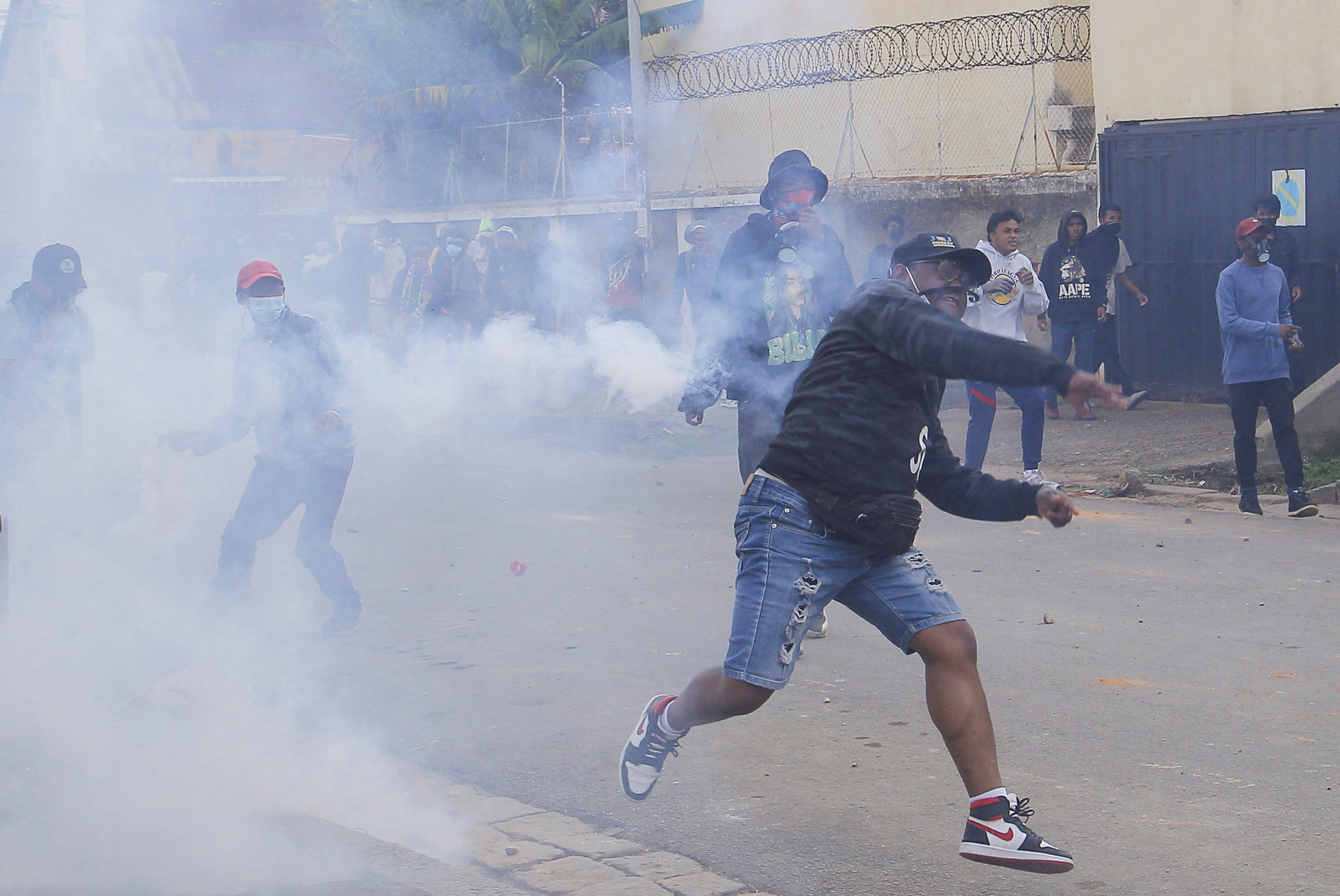 Protesters throw stones at police during a nationwide youth-led protest against worsening water shortages and power outages, and demands for the resignation of Madagascar President Andry Rajoelina, in Antananarivo, Madagascar, on October 3, 2025