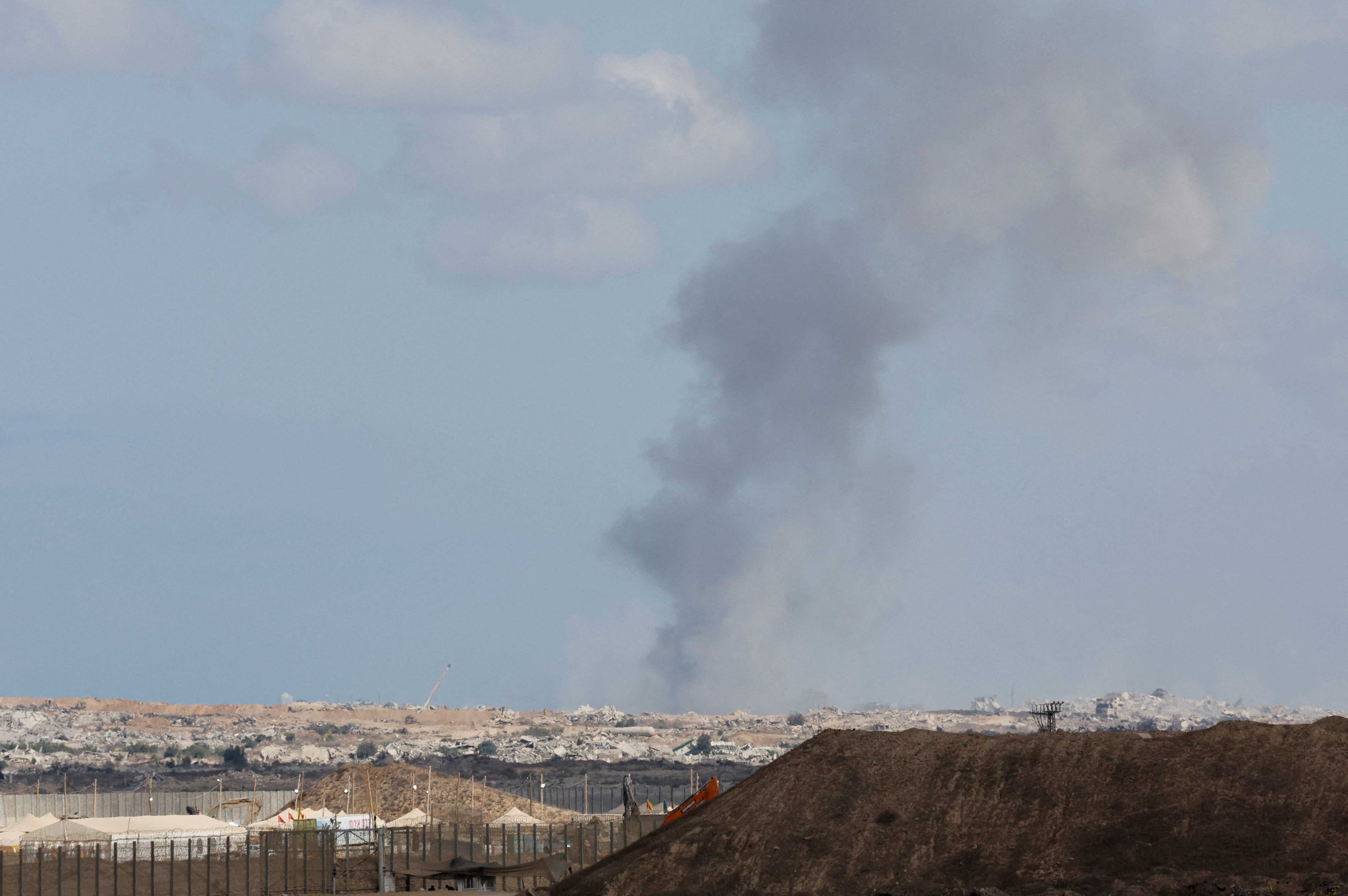 Smoke rises from Gaza after an explosion, on the day the Israeli military said it had resumed enforcing the Gaza ceasefire agreement after a series of strikes across the Gaza Strip, as seen from Israel, October 29, 2025. REUTERS/Ammar Awad
