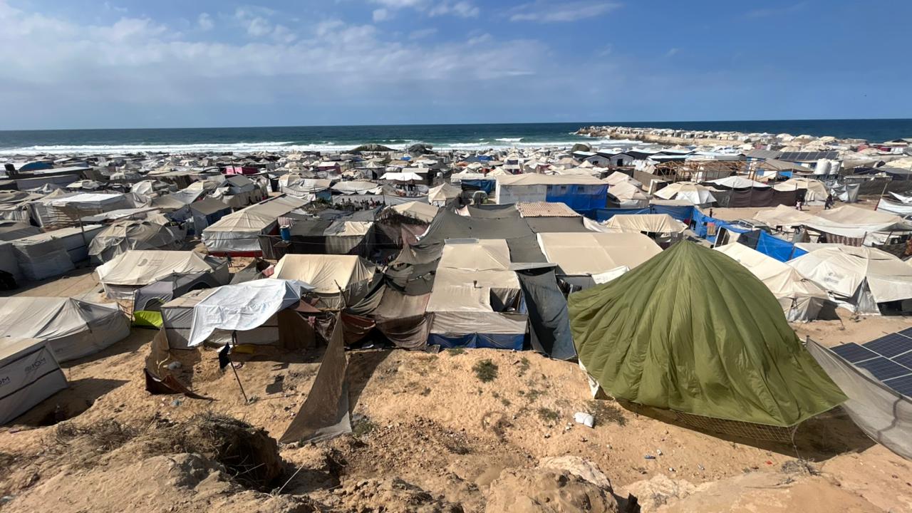 Tents housing displaced Palestinians stretch across the coastal sands of Al-Mawasi, Gaza Strip,