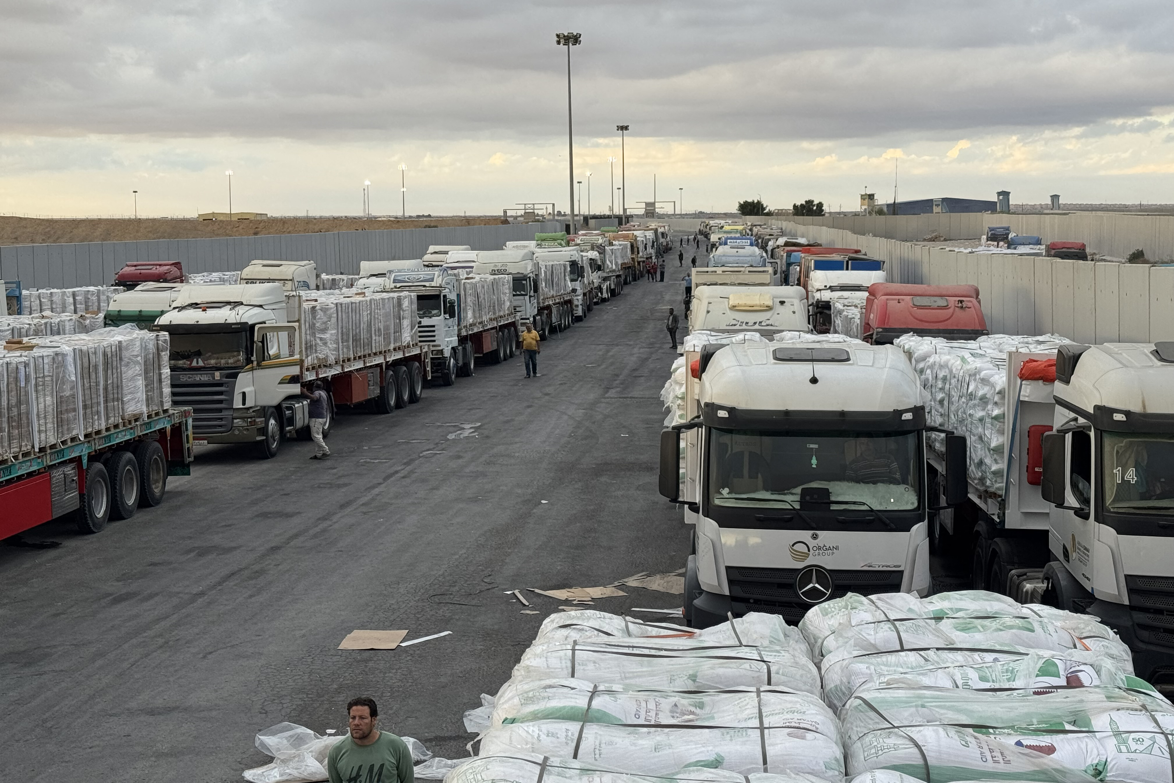 Trucks carrying aid to Gaza began passing through the Rafah Border Crossing