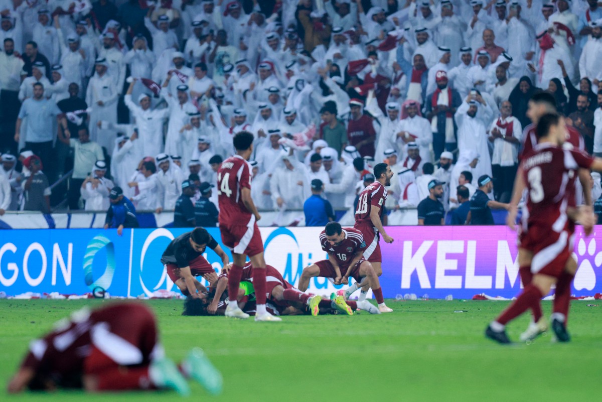 Qatar's players celebrate after the FIFA World Cup 2026 Asian qualifier football match between Qatar and the UAE at Jassim Bin Hamad Stadium