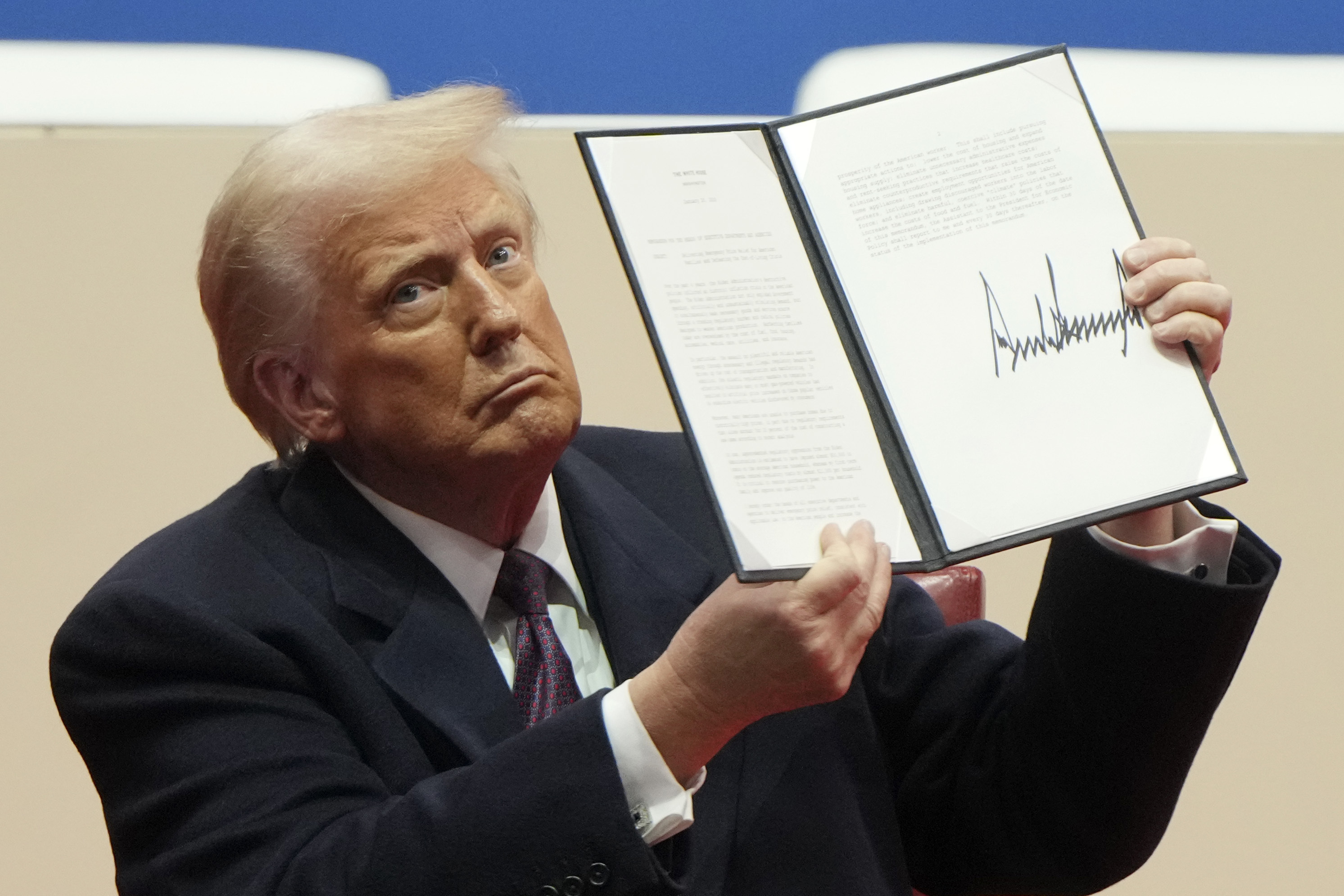 Trump holds up an executive order