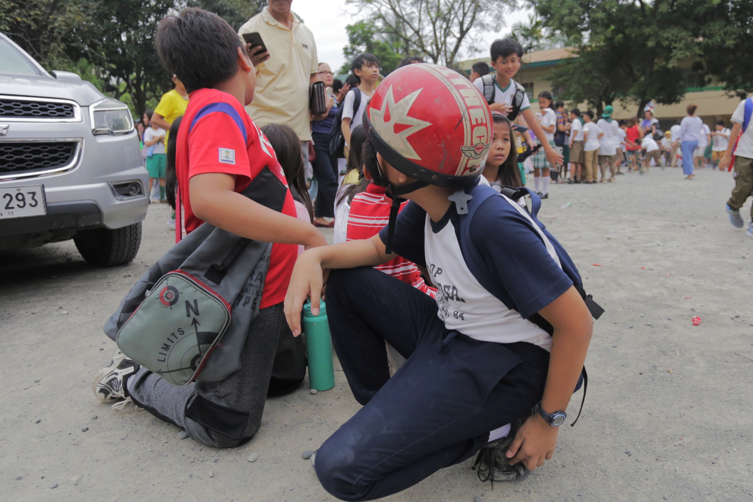 Children evacuate a school after a strong earthquake in Davao City, Philippines on Friday Oct. 10, 2025. (AP Photo/Manman Dejeto)