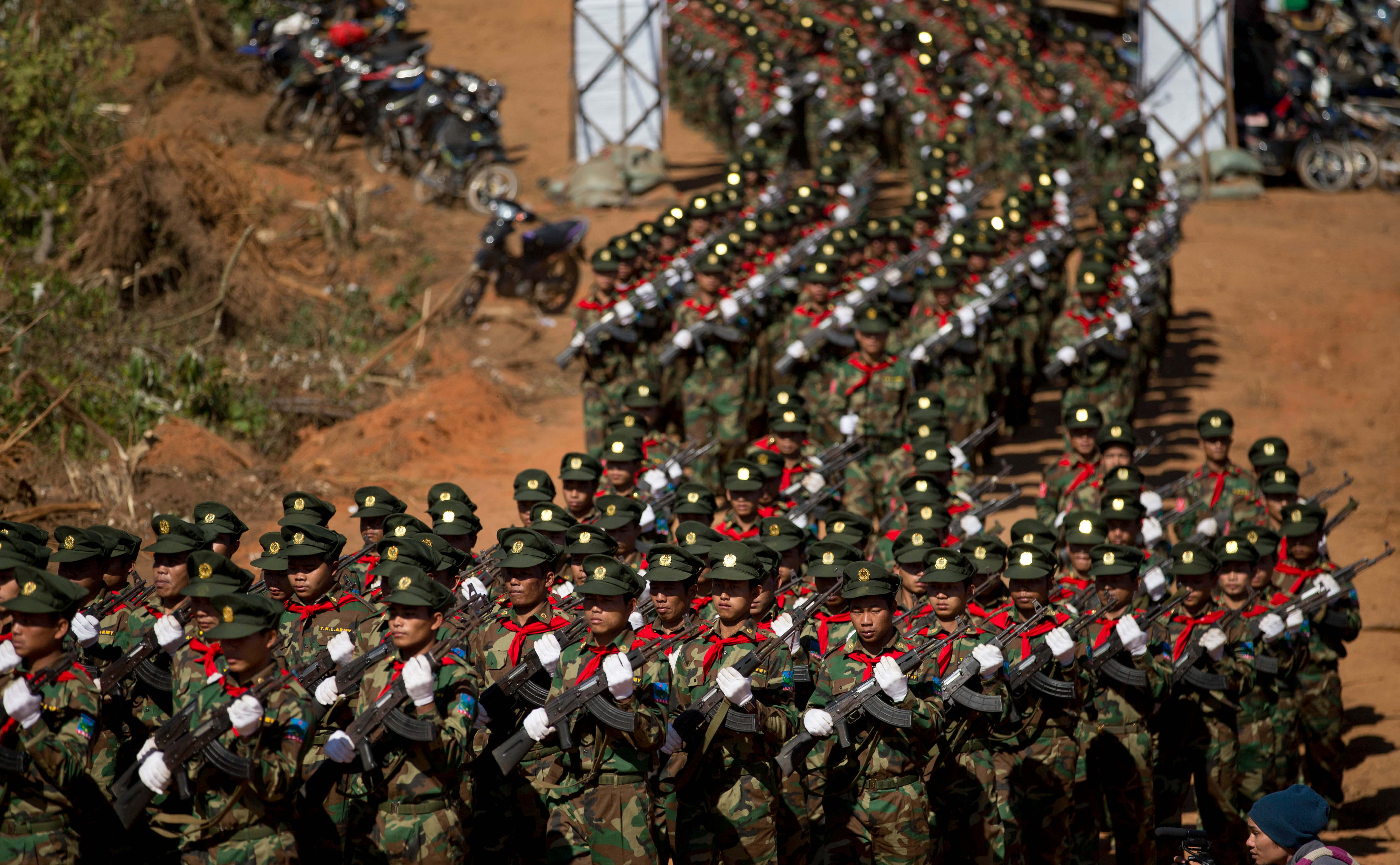 FILE - Ta'ang National Liberation army troops march in Mar Wong Village, northern Shan state during a celebration marking the 52nd anniversary of their insurrection against successive Myanmar governments, Jan. 12, 2015. (AP Photo/Gemunu Amarasinghe, File)