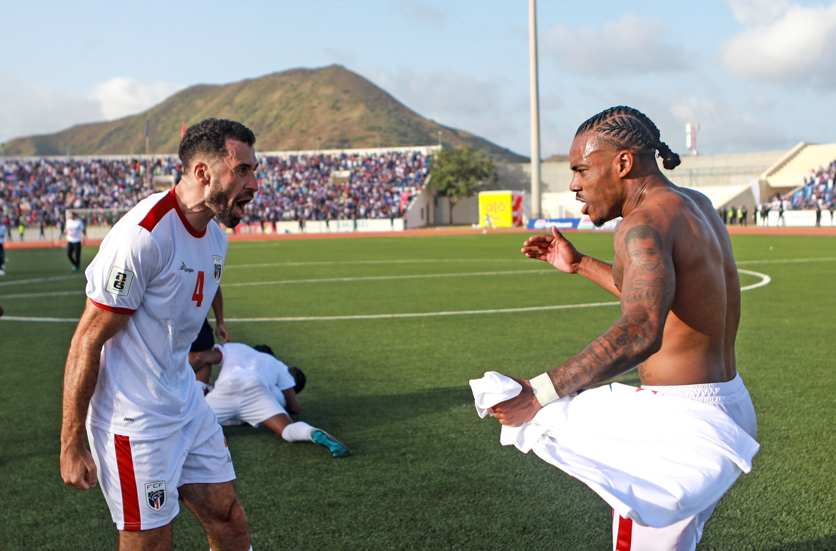 Roberto Lopes, left, and Garry Rodrigues react.