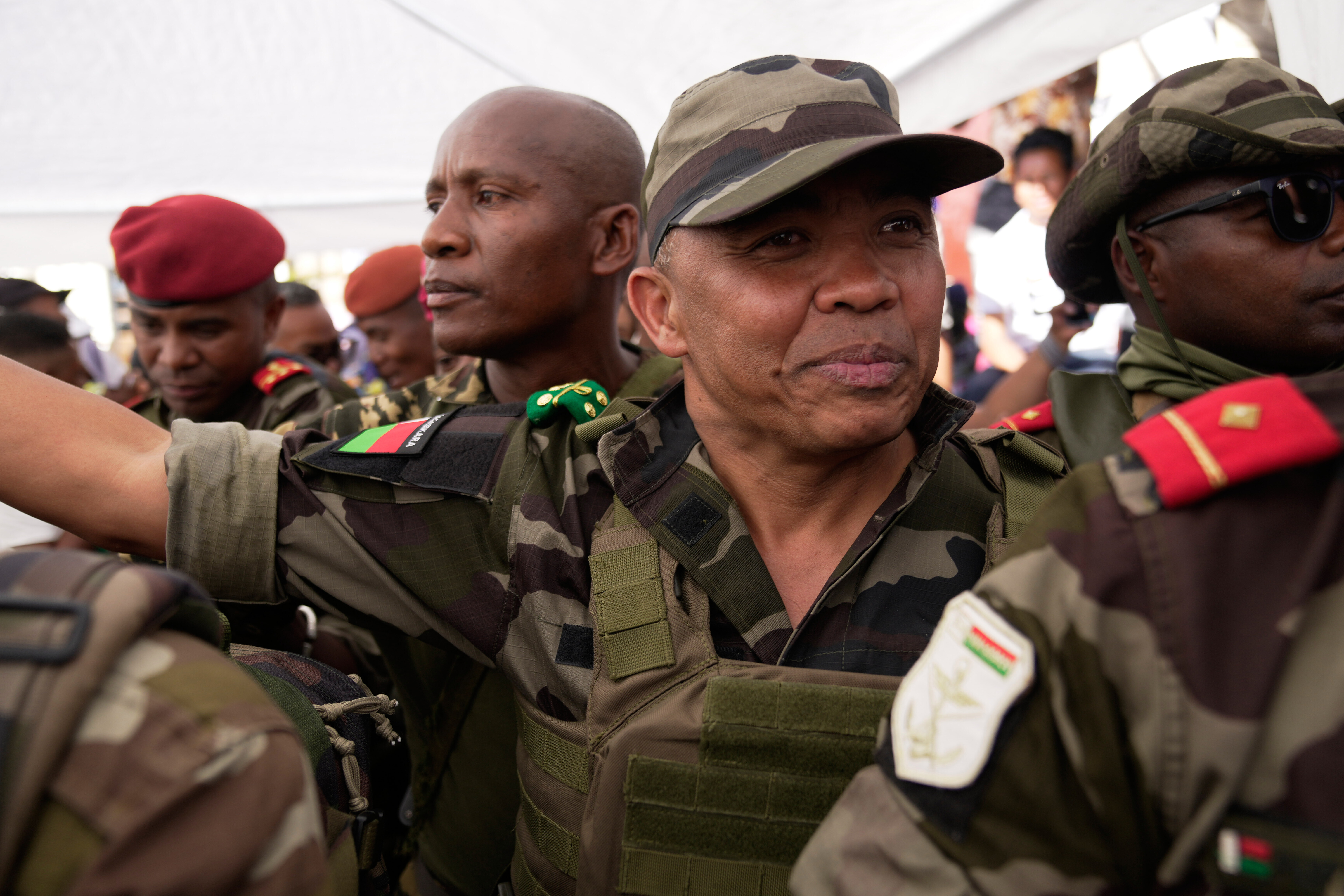 CAPSAT military unit commander Col. Michael Randrianirina joins protesters to announce that the armed forces are taking control of the country in Antananarivo, Madagascar, Tuesday, Oct. 14, 2025. (AP Photo/Brian Inganga)