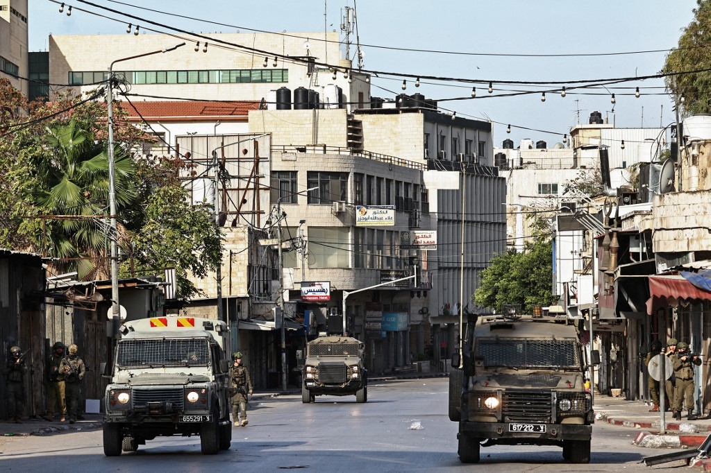 Israeli troops deploy during a raid in the occupied West Bank