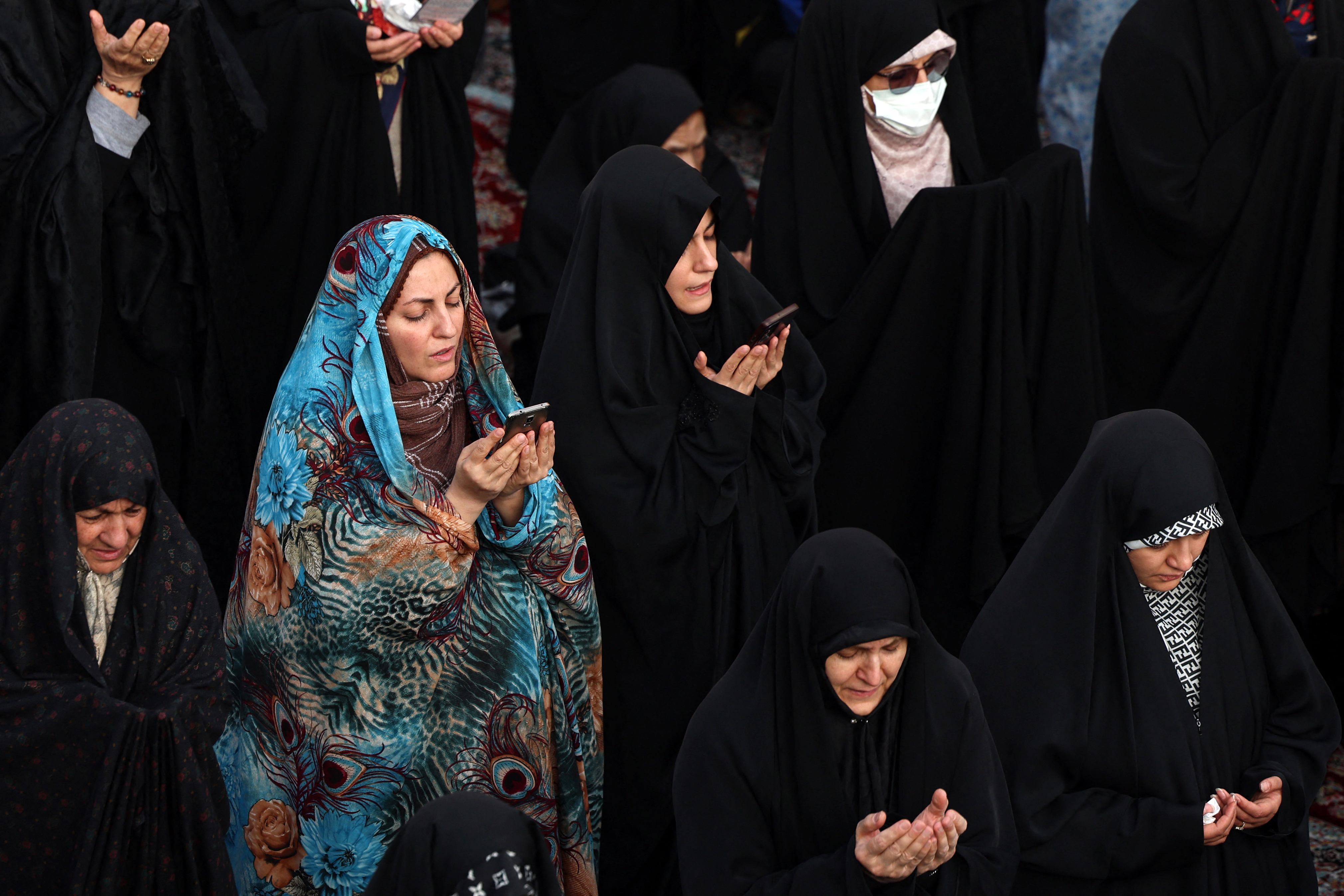 Iranian women perform a prayer for rainfall at the Saleh Shrine in Tehran