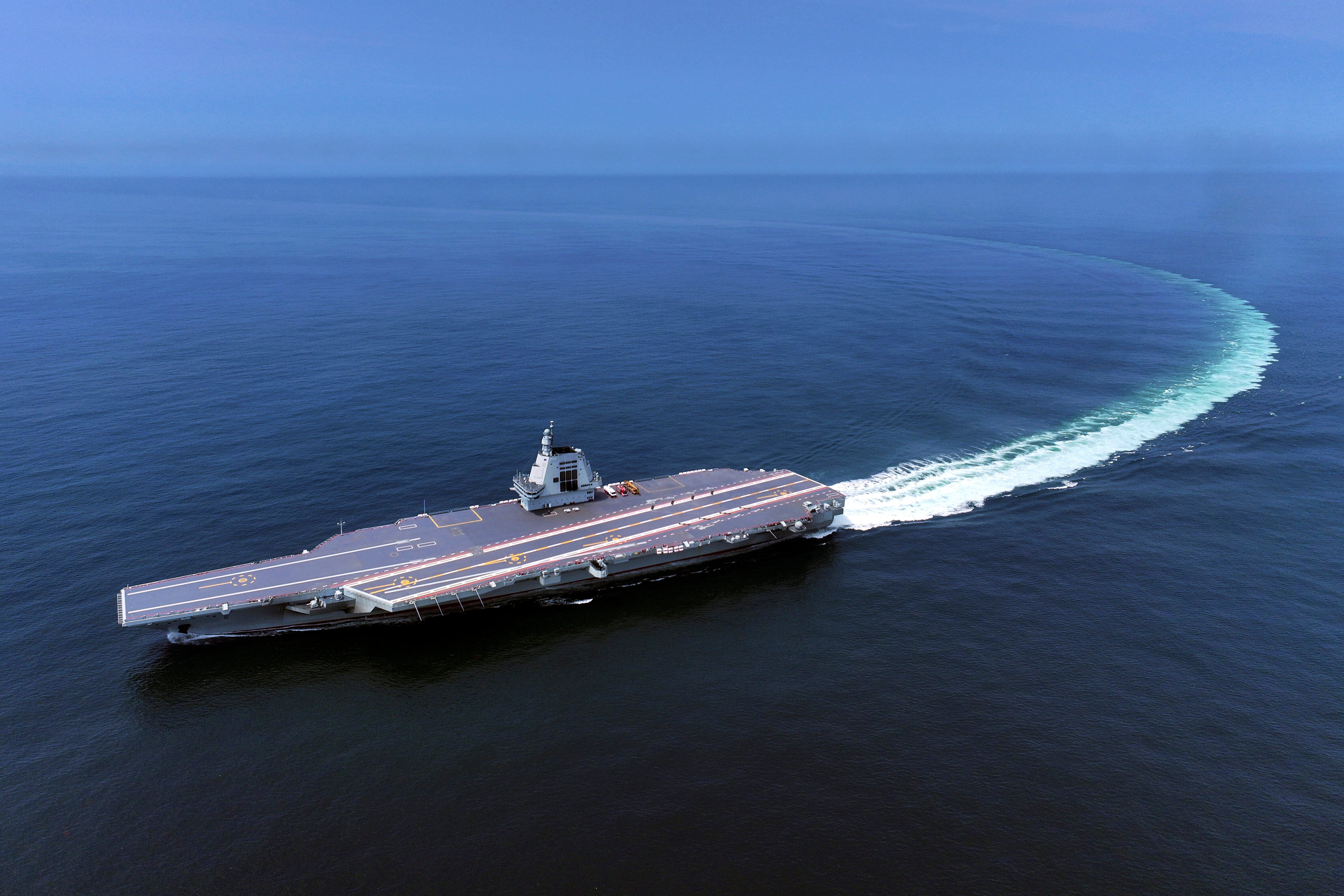 China's third conventionally powered aircraft carrier, the Fujian, conducts a maiden sea trial.
